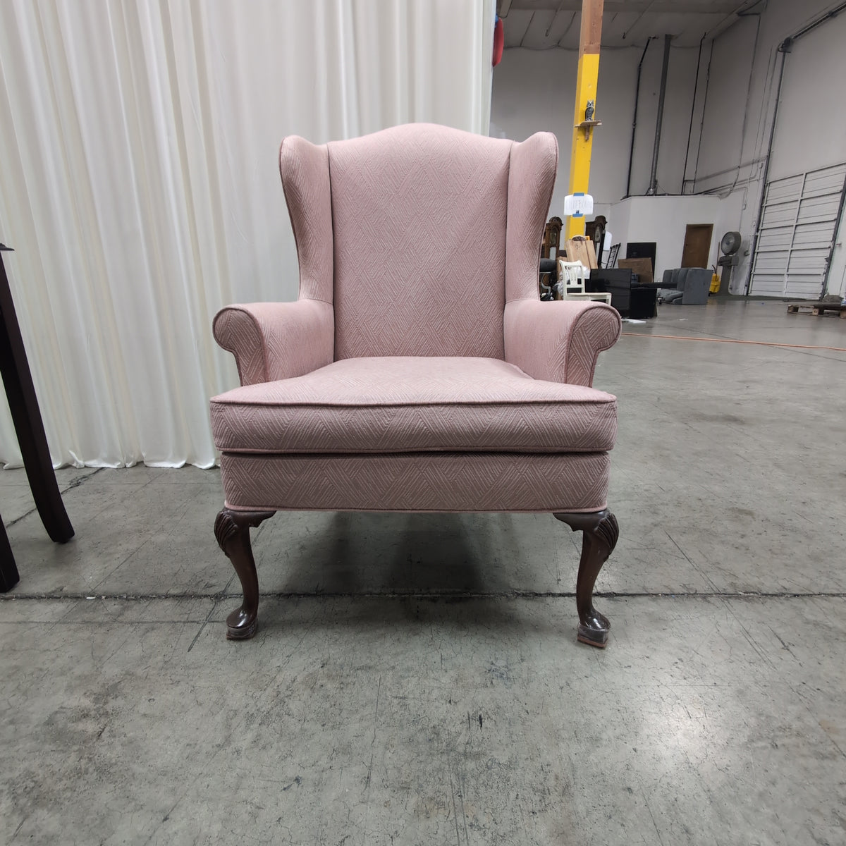 Mauve Upholstered Wingback Chair with Geometric Pattern