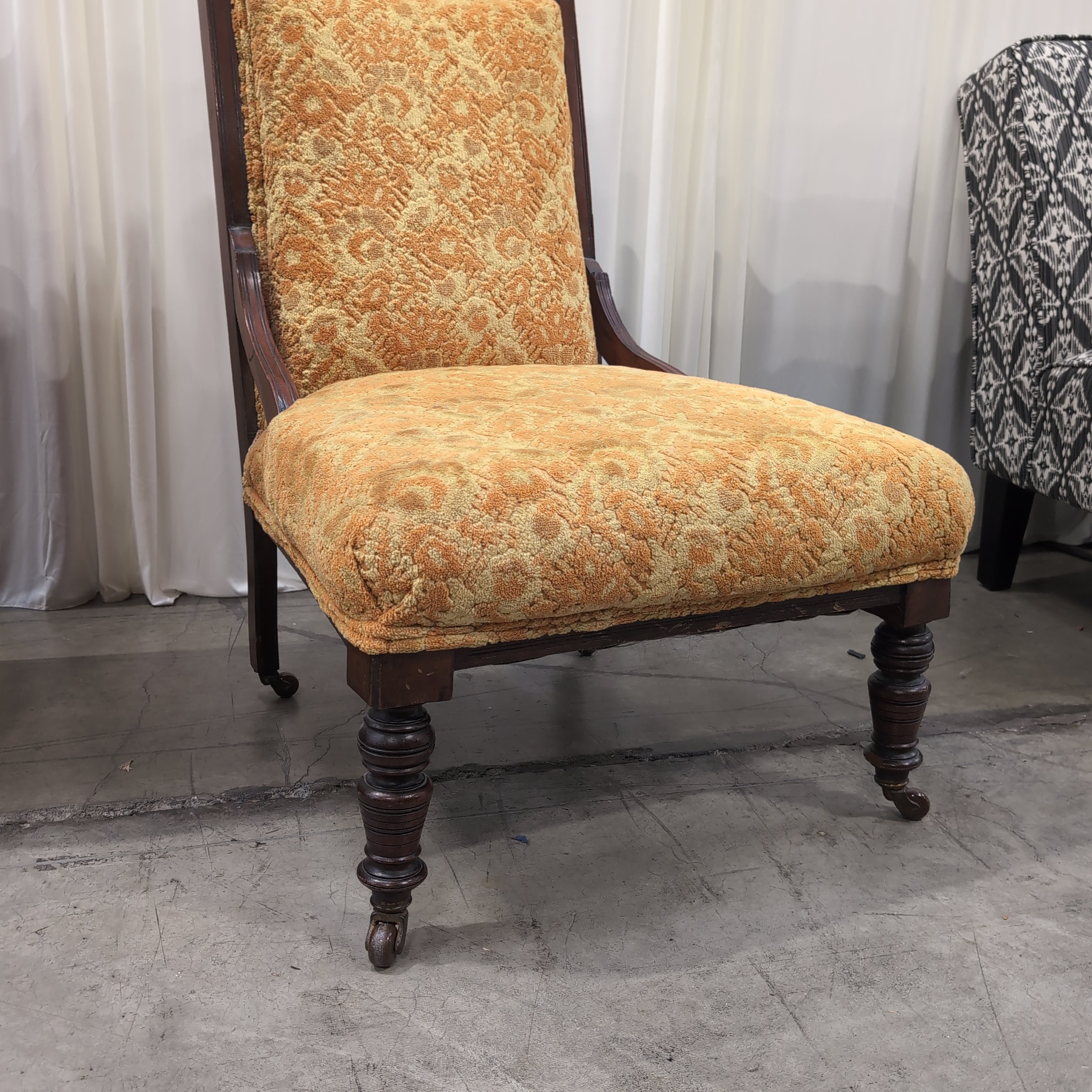 Carved Dark Wood Accent Chair with Patterned Upholstery