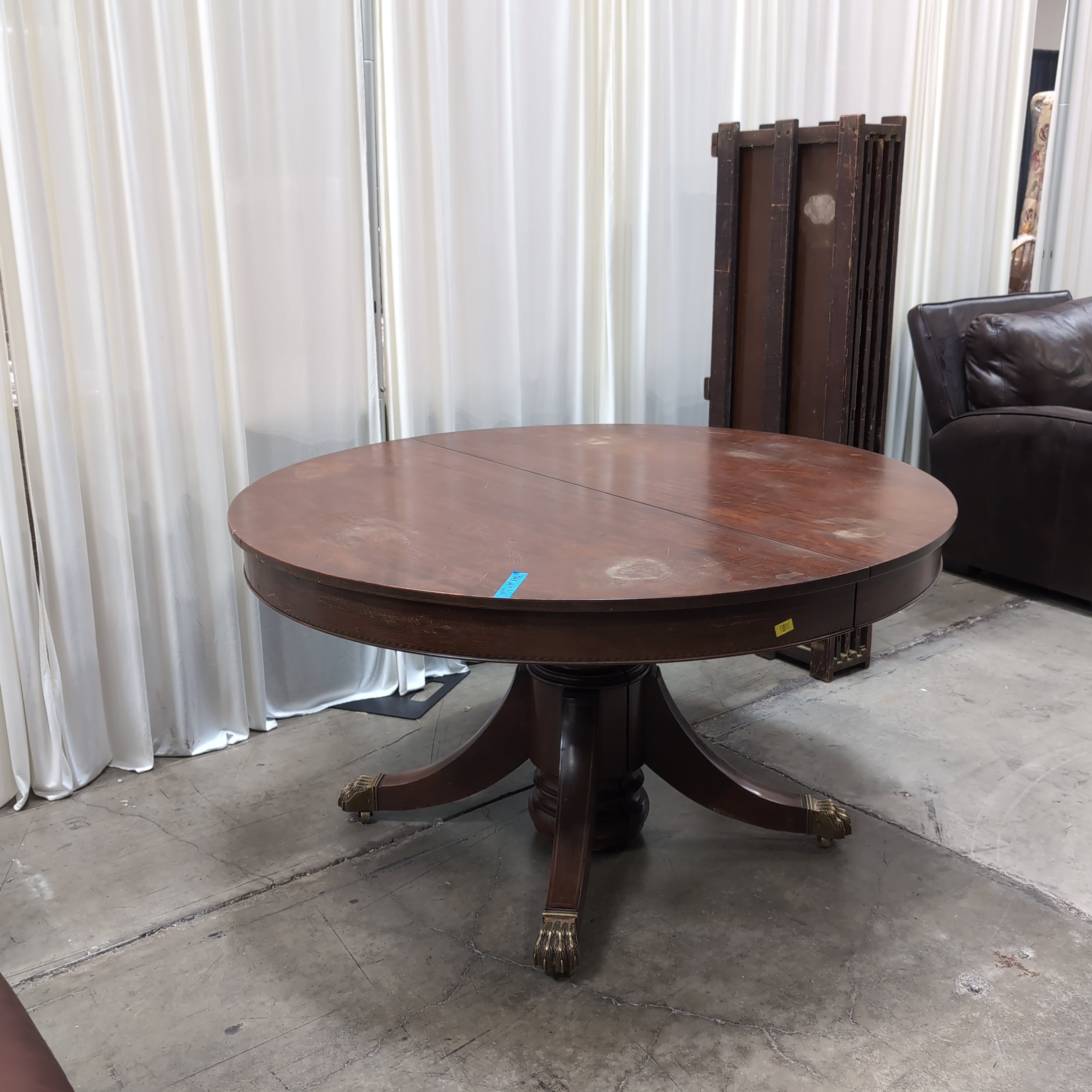 Round Dark Wood Pedestal Dining Table with Claw Feet