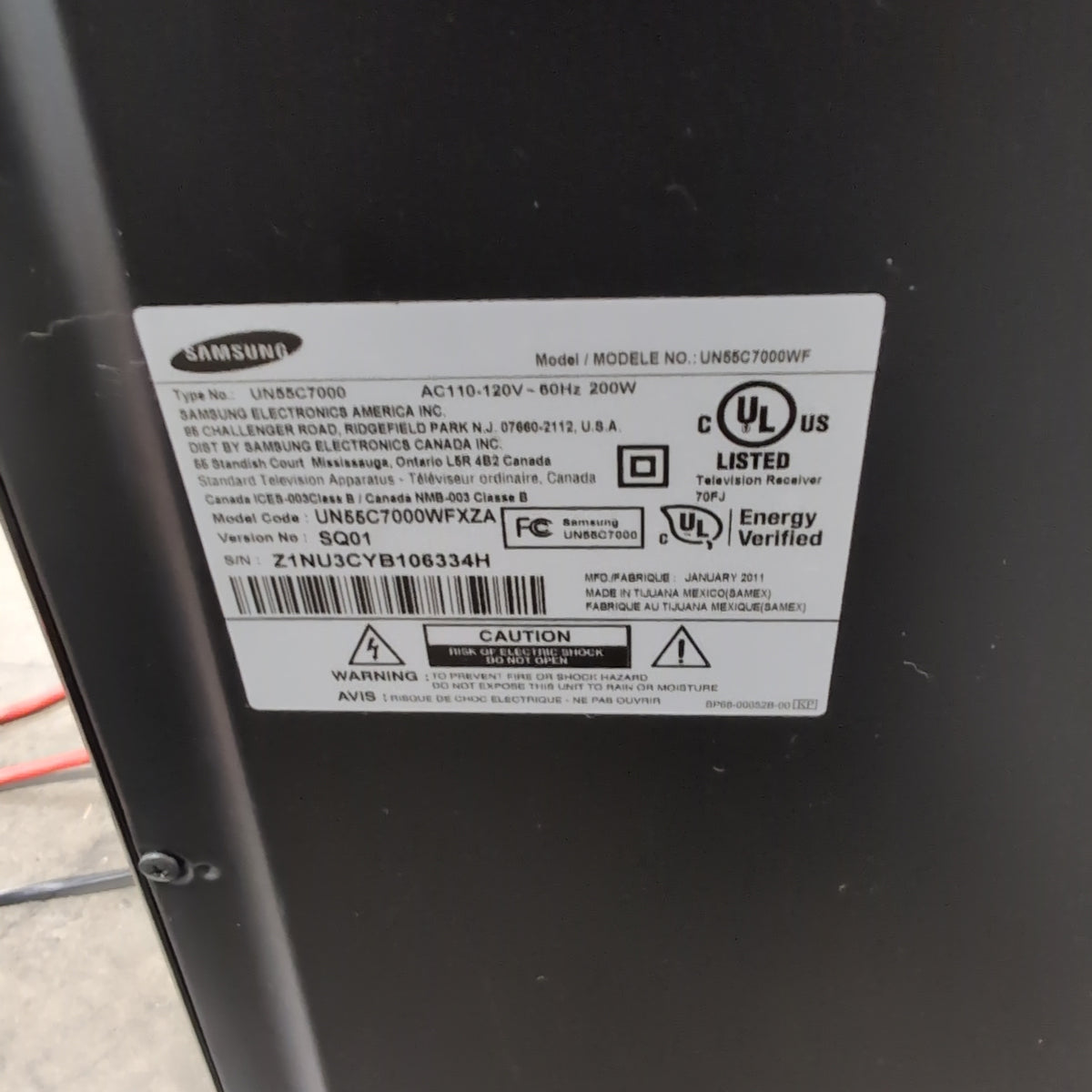 Samsung Black Flat Screen TV with Arch Stand