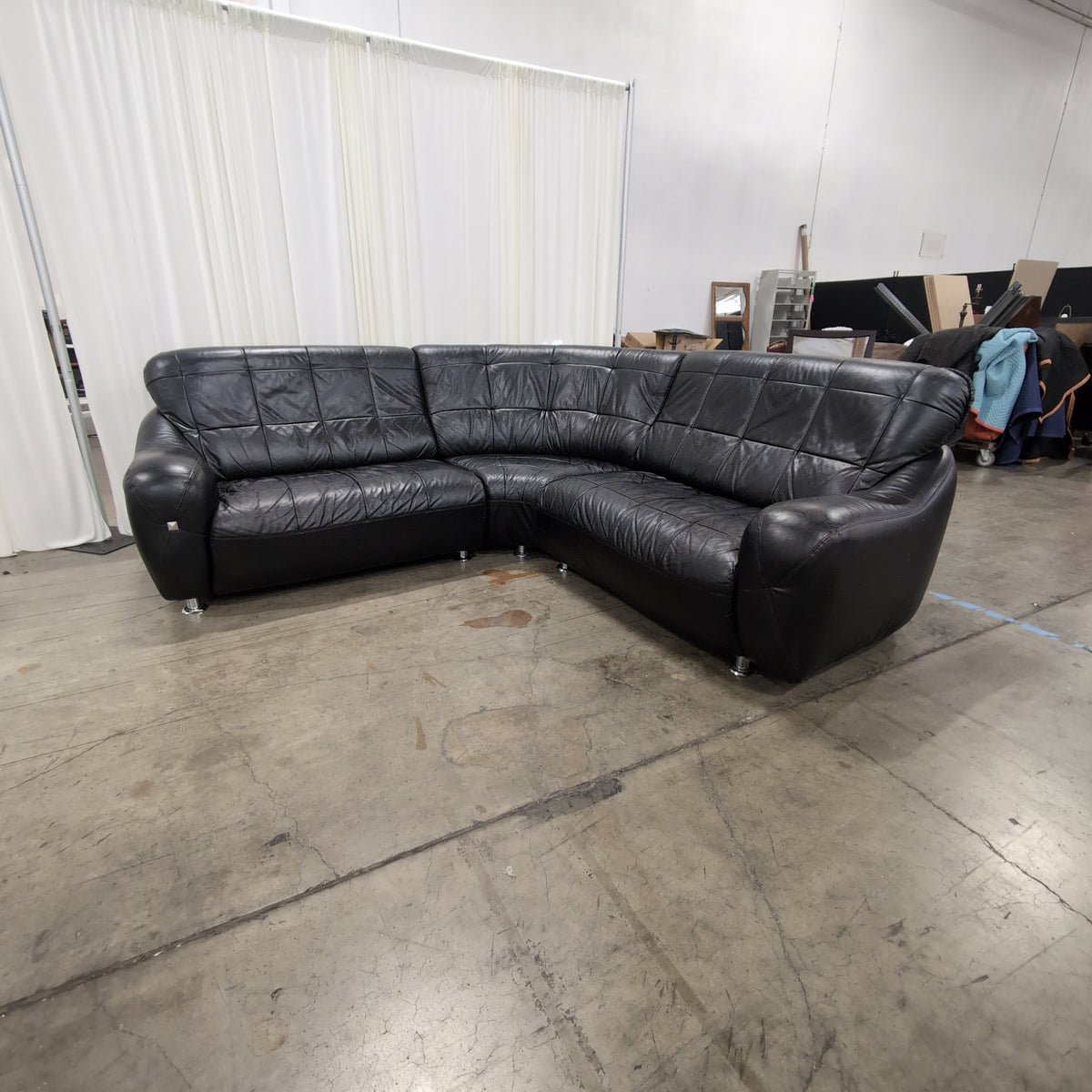 Black Tufted Leather Sectional Couch with Chrome Feet