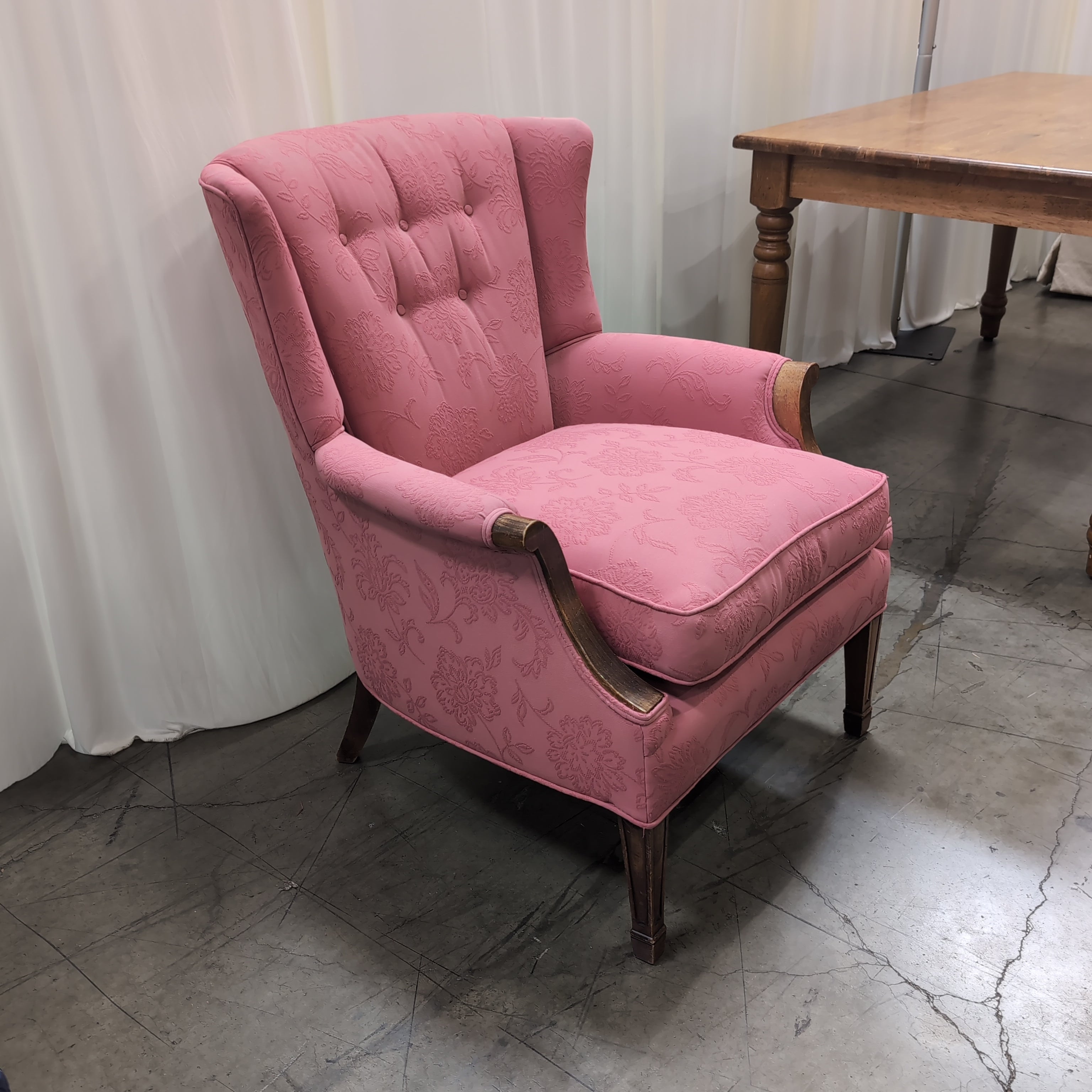 Pink Floral Upholstered Wingback Chair with Carved Wood Arms