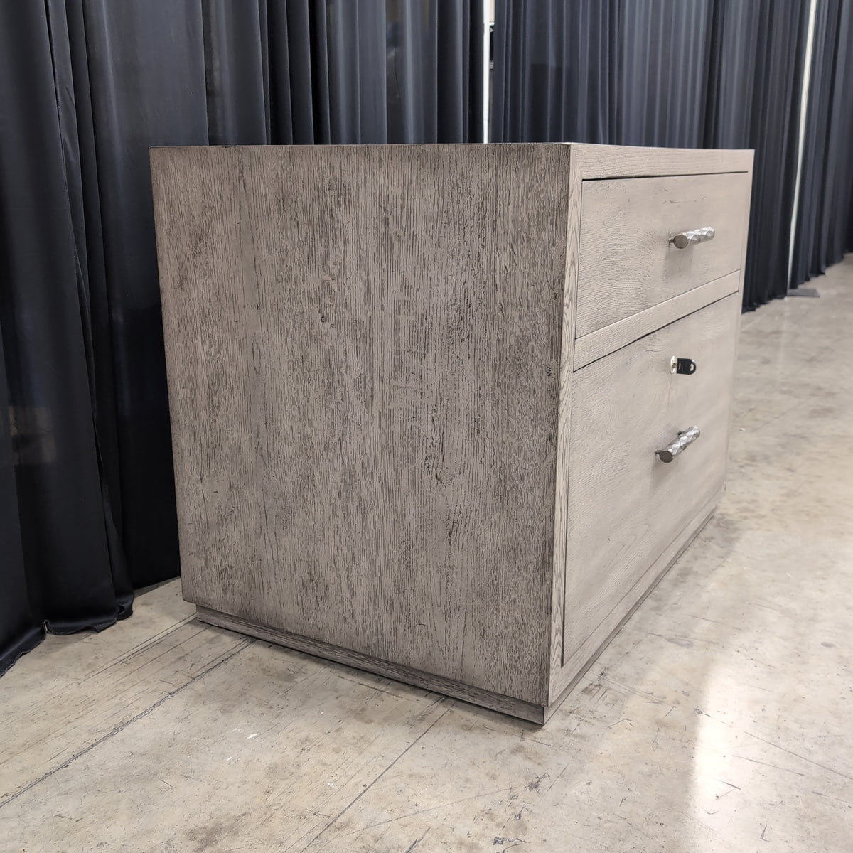 Light Wood Two-Drawer Nightstand with Textured Hardware