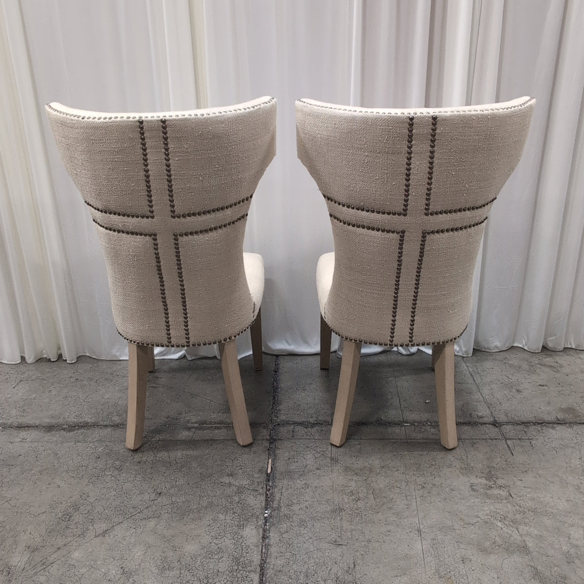 Light Beige Upholstered High-Back Chair with Nailhead Trim
