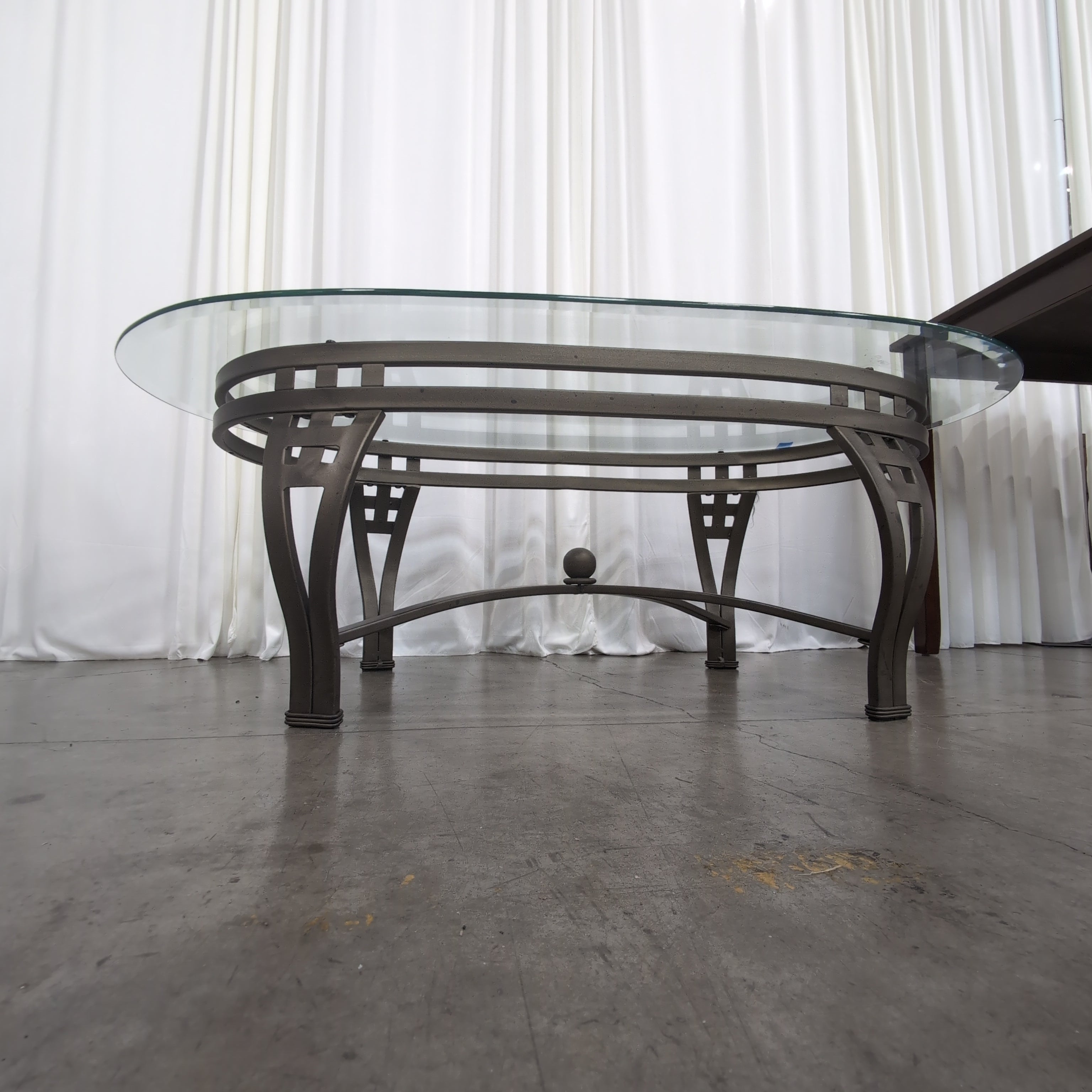 Oval Glass Coffee Table with Dark Metal Base