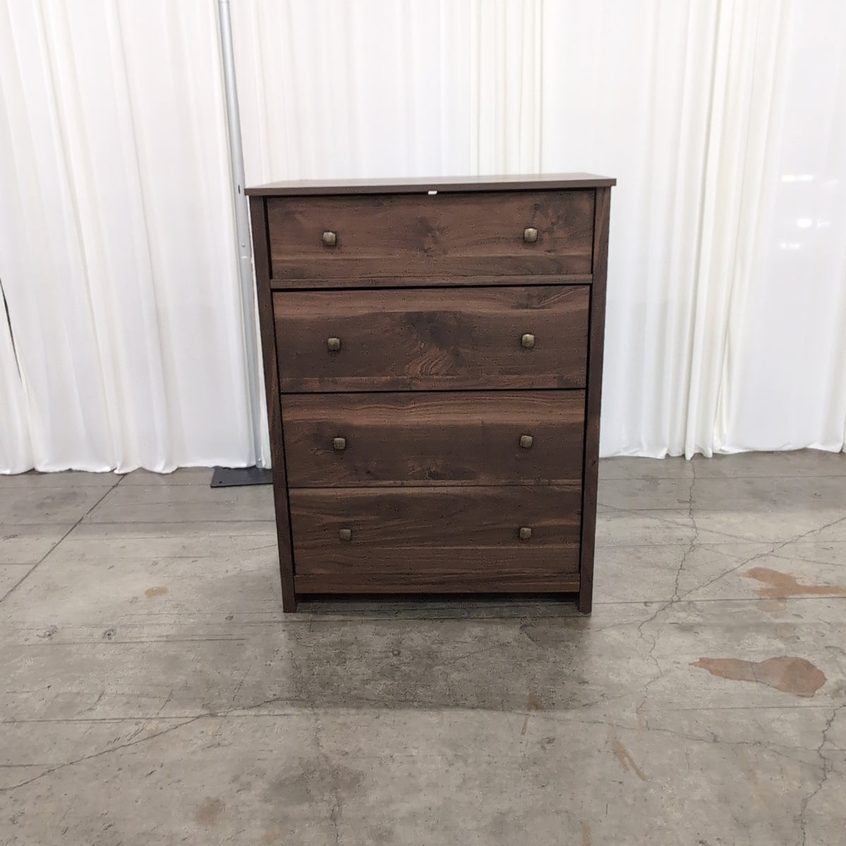 Dark Wood Four-Drawer Dresser with Metal Pulls