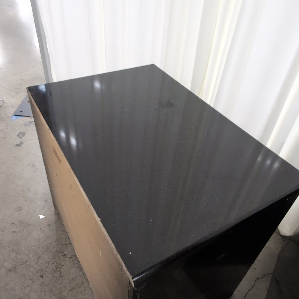Black Lacquer Four-Drawer Dresser with Gold Pulls
