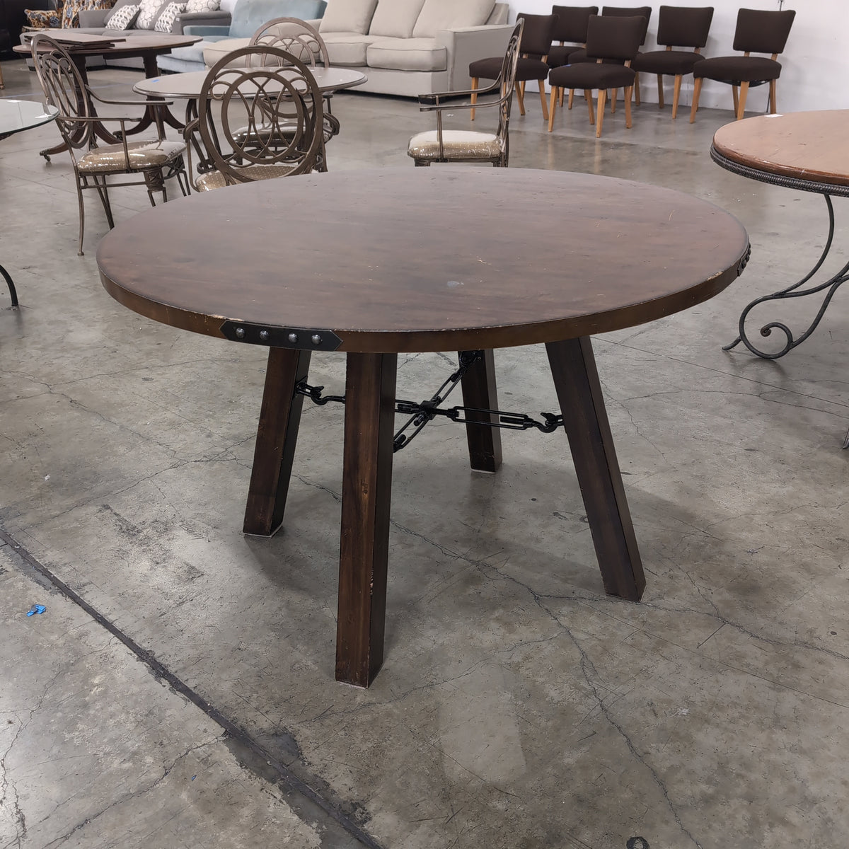 Rustic Dark Wood Round Dining Table with Metal Accents