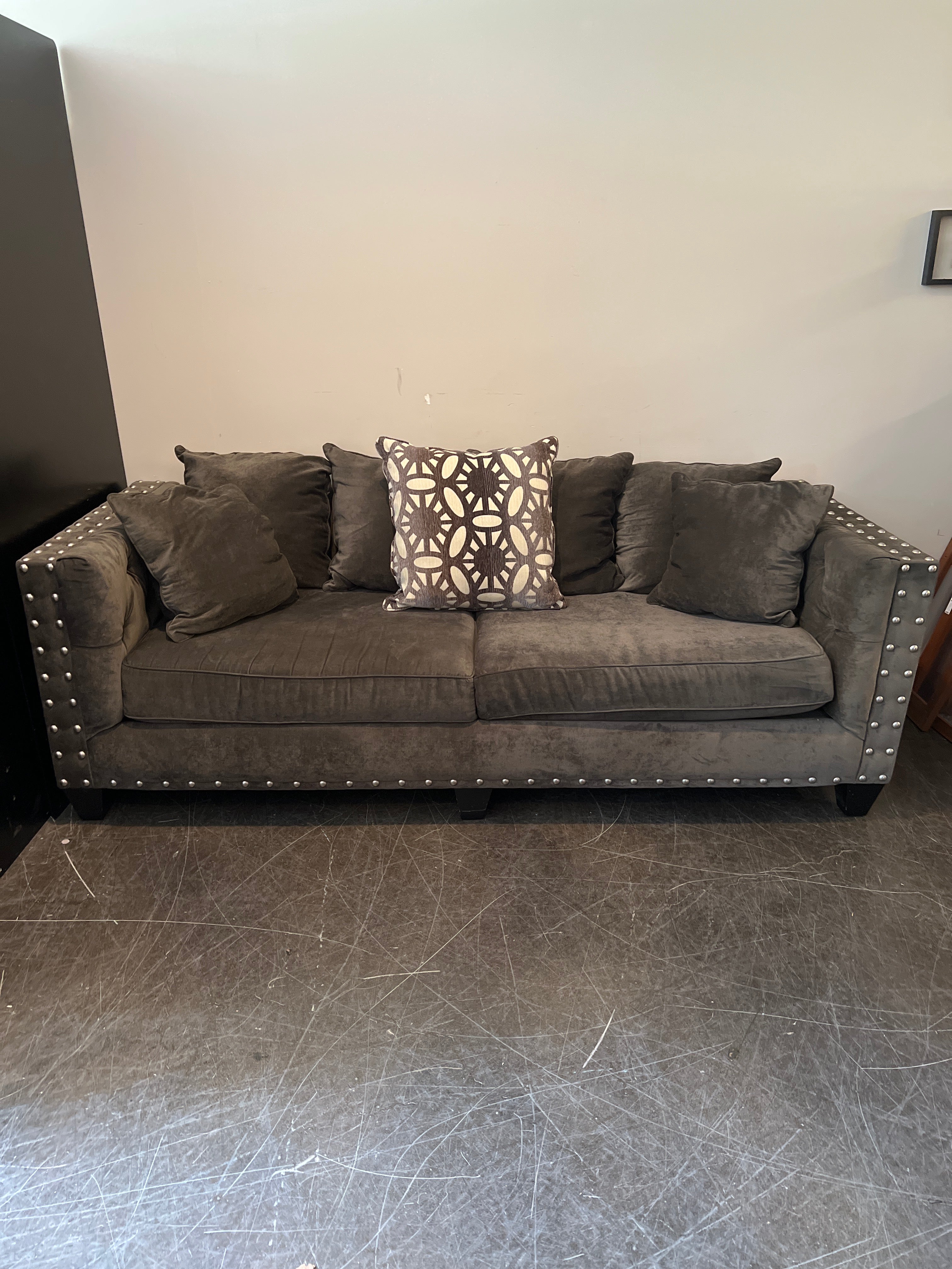 Dark Brown Tufted Sofa with Metal Accents
