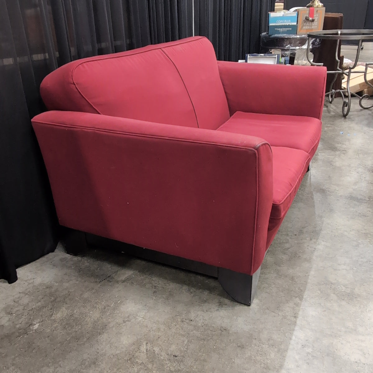 Red Upholstered Two-Cushion Fabric Loveseat with Dark Wood Base