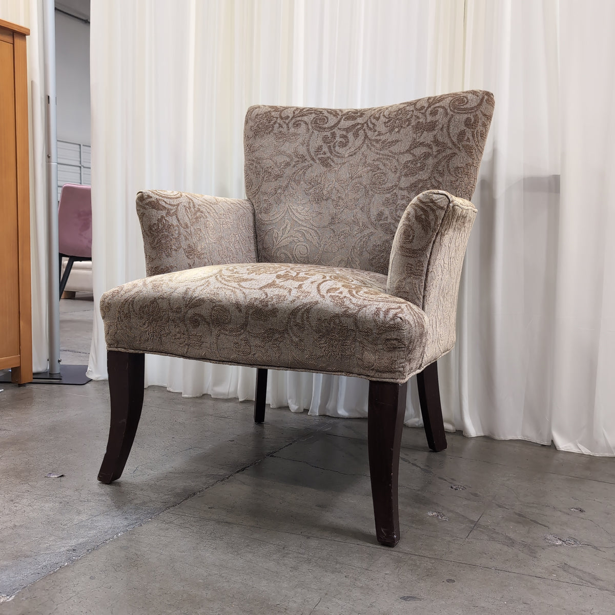 Beige Damask Upholstered Wingback Armchair with Dark Wood Legs
