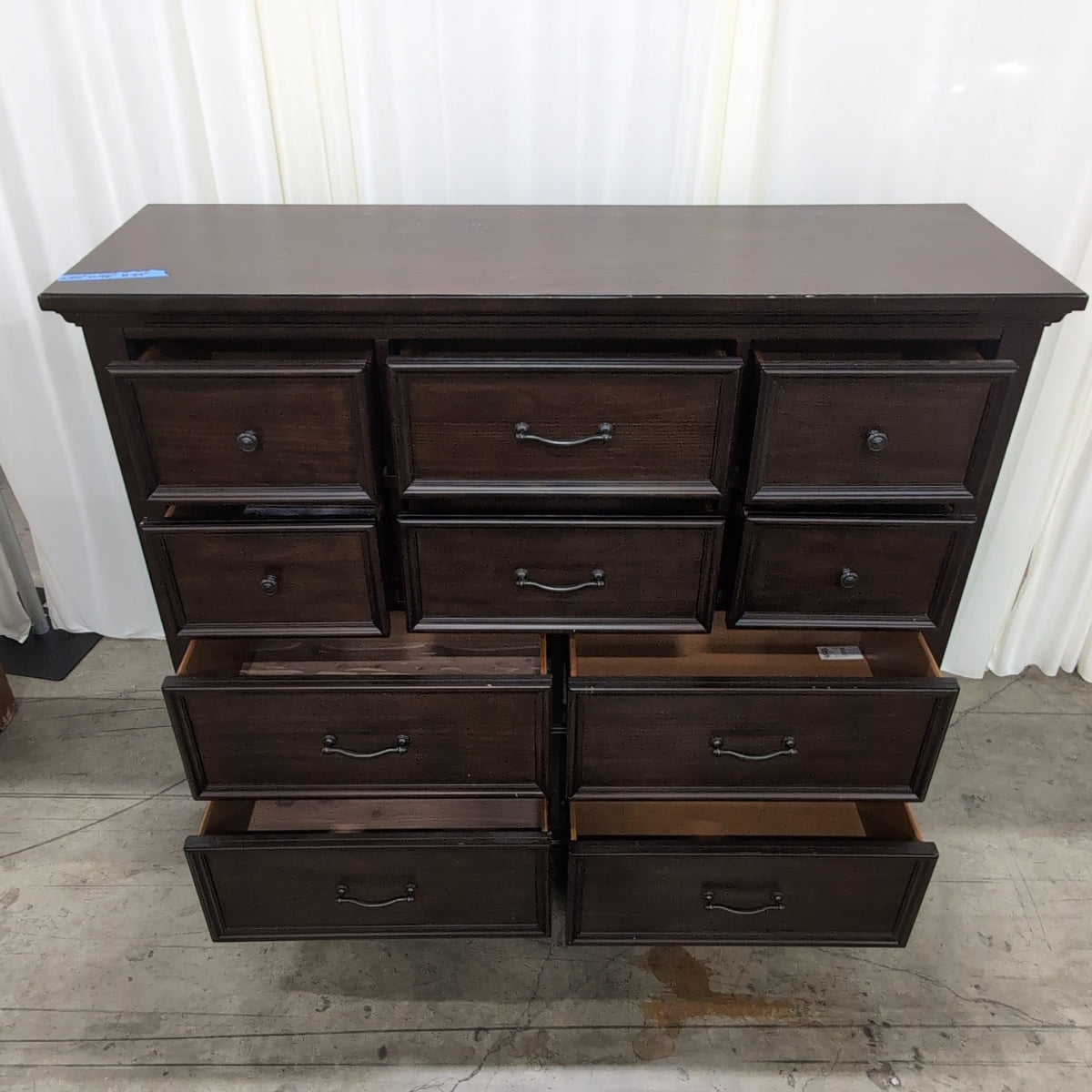 Dark Brown Wood Eight-Drawer Dresser with Ornate Hardware