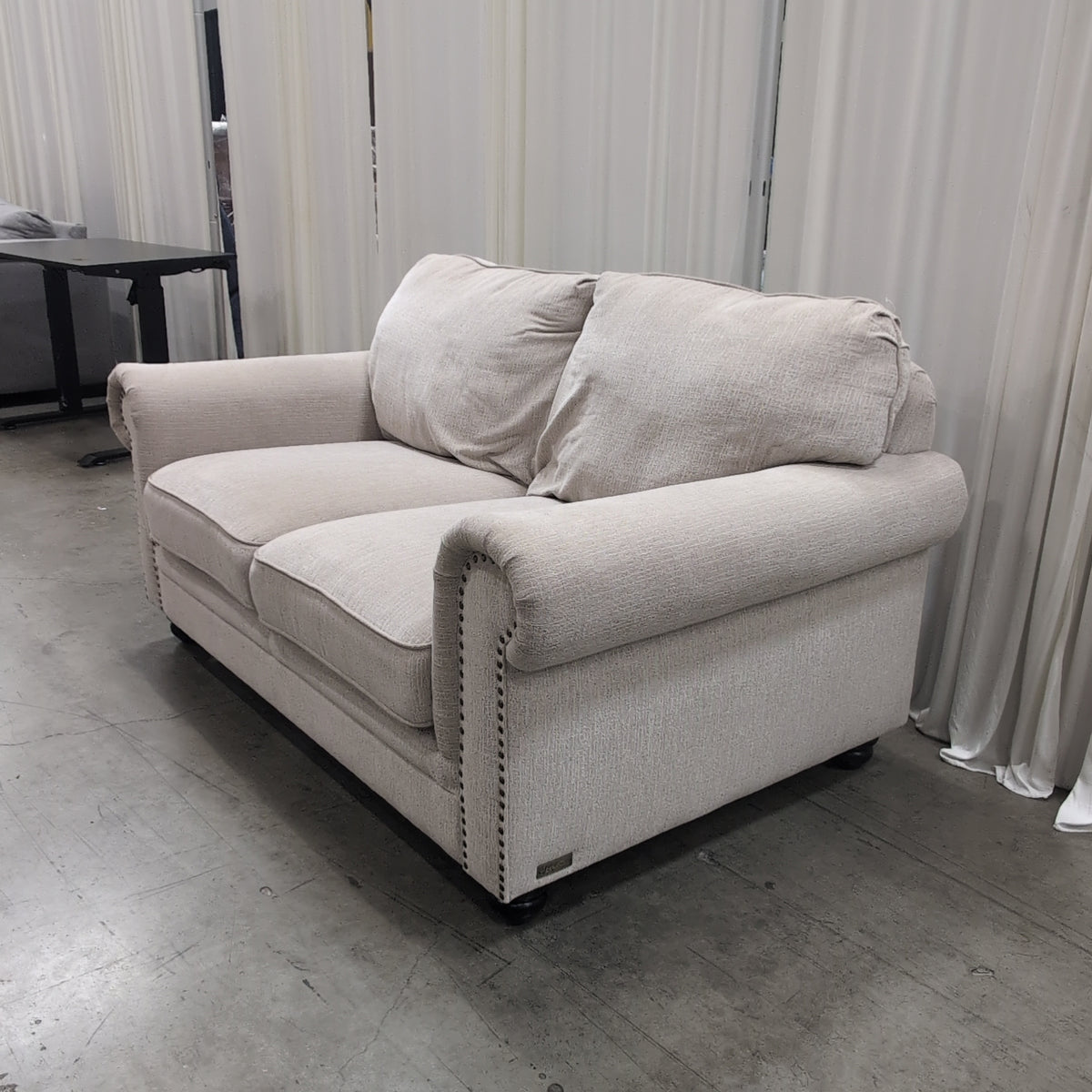 Textured Beige Fabric Loveseat with Nailhead Trim