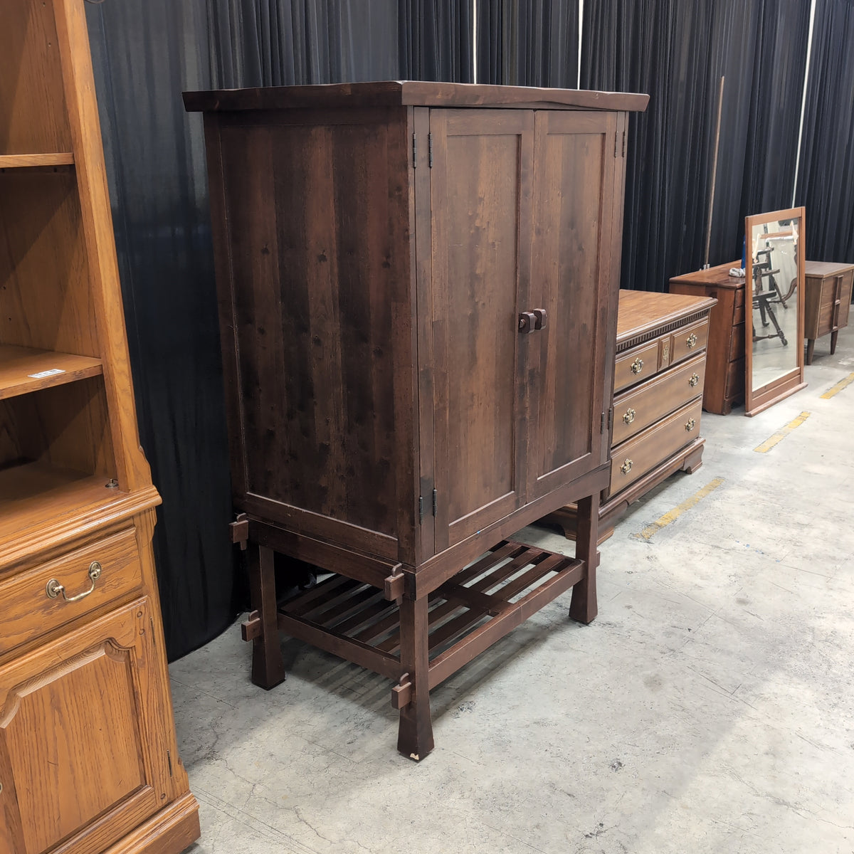 Rustic Dark Wood Two-Door Armoire with Slatted Base