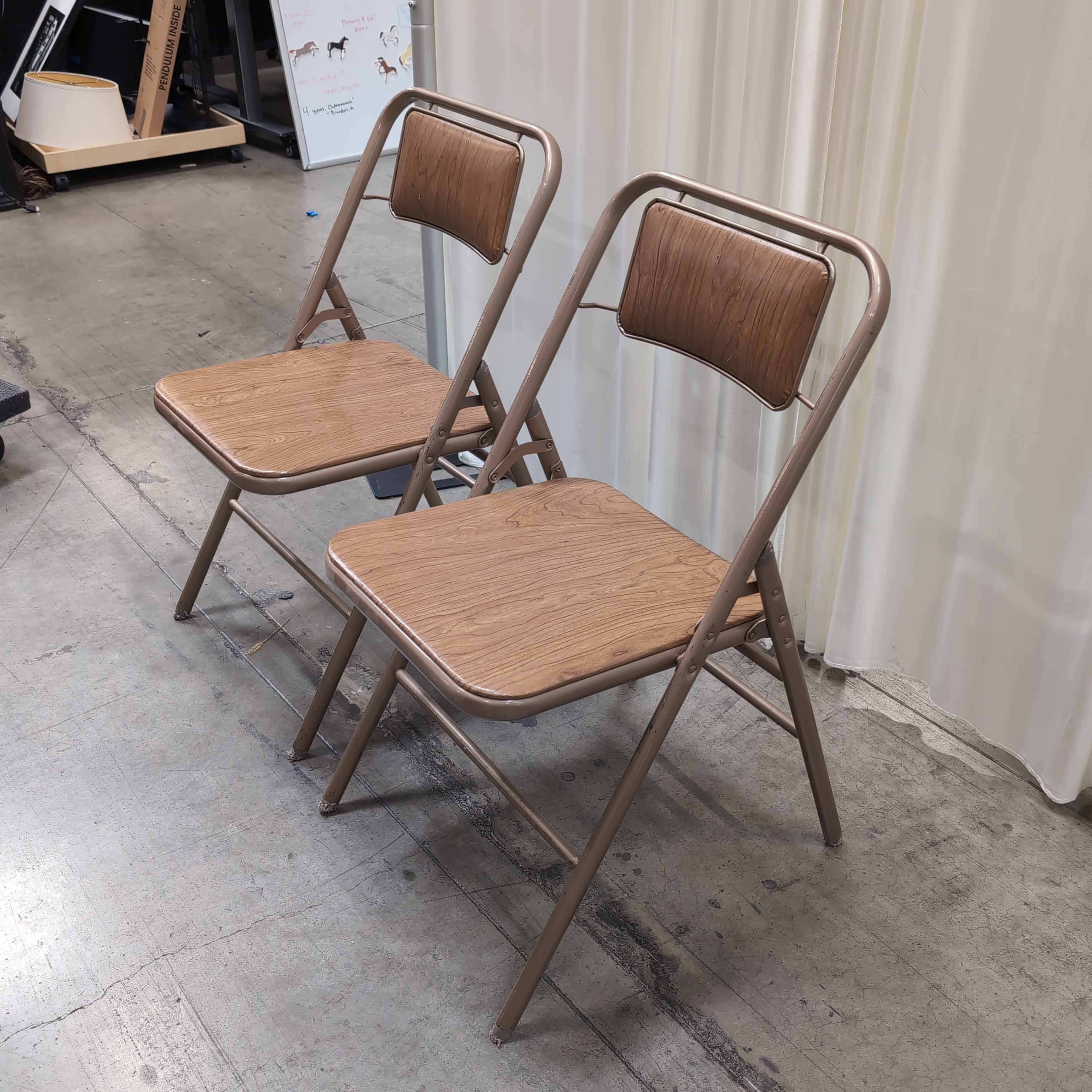 Pair of Bronze Metal Folding Chairs with Wood-Look Seats