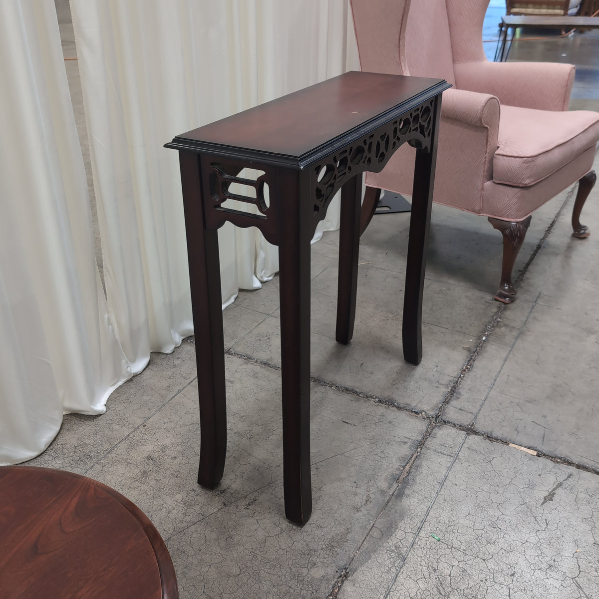 Dark Stained Wood Console Table with Ornate Details