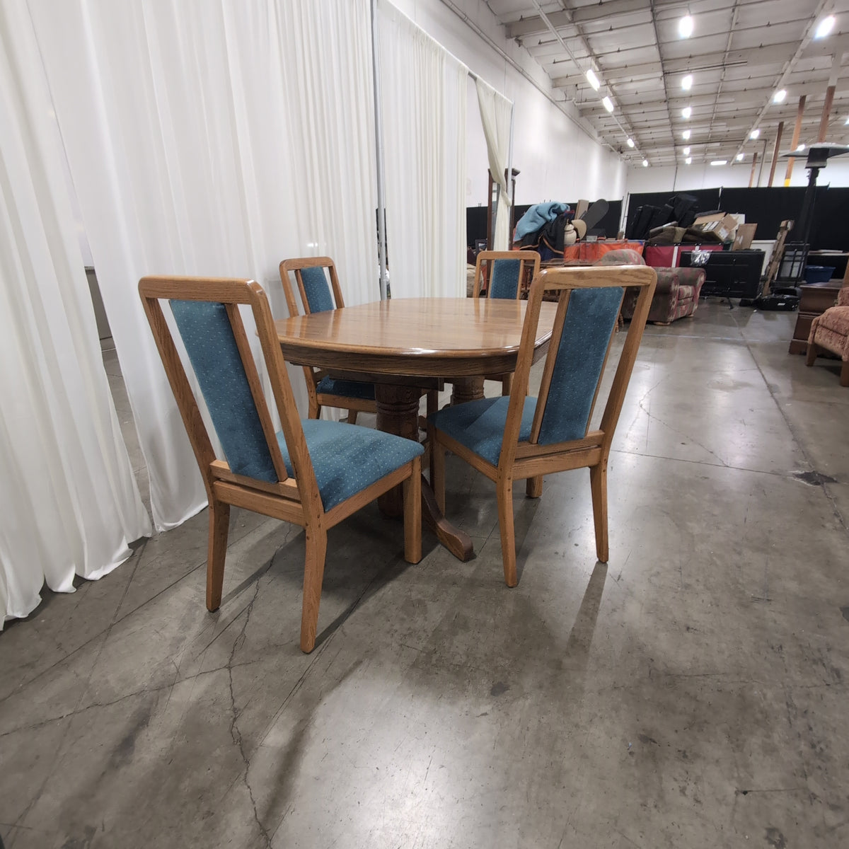 Reddish Brown Oval Pedestal Dining Table