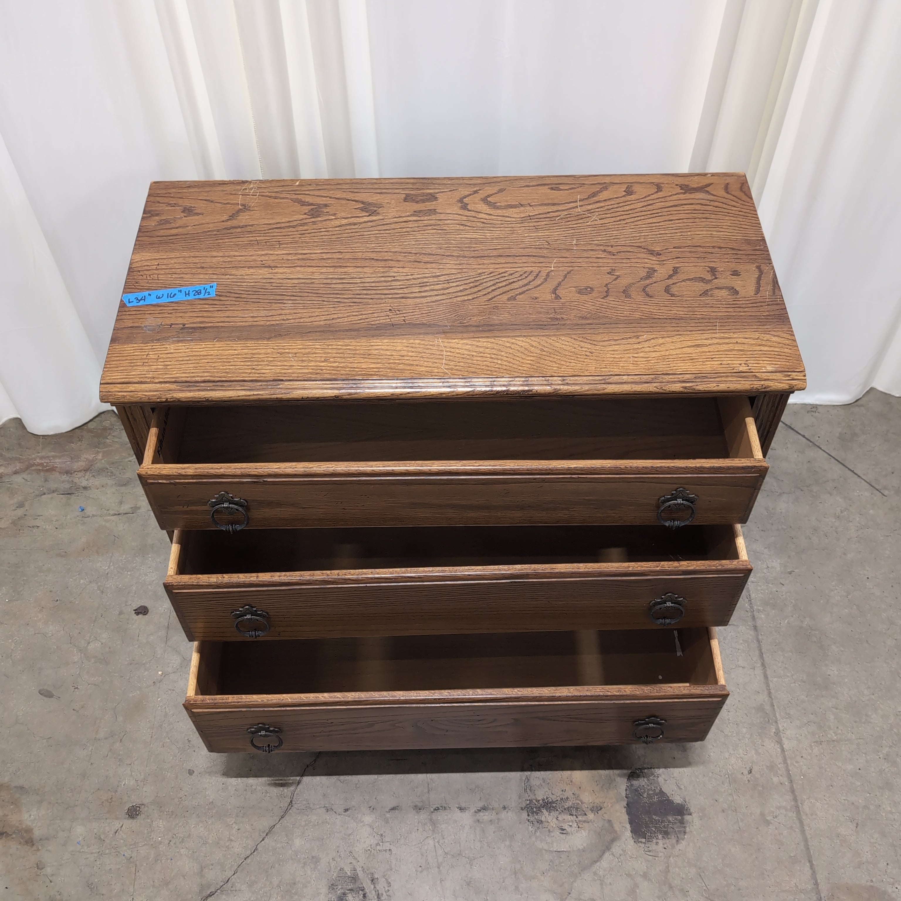 Traditional Brown Wood Three-Drawer Dresser with Ornate Hardware
