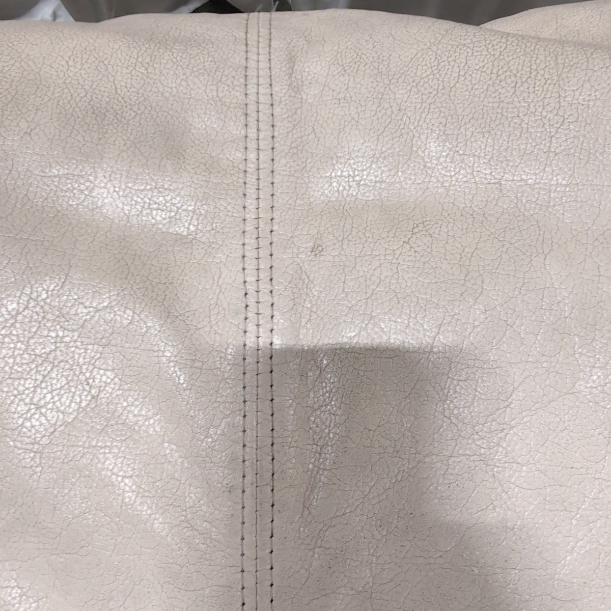 Off-White Faux Leather Ottoman with Top Stitching