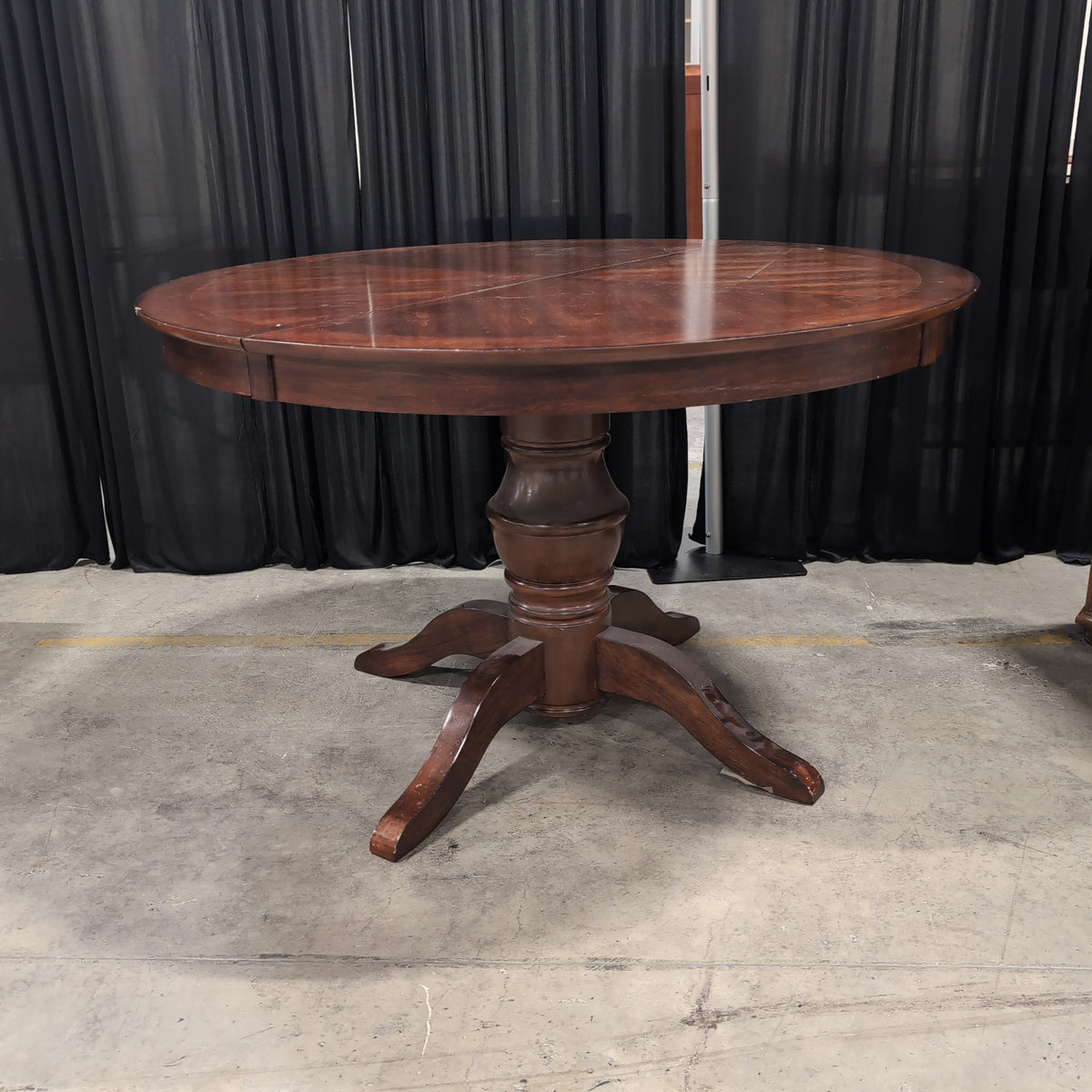 Round Dark Wood Dining Table with Pedestal Base