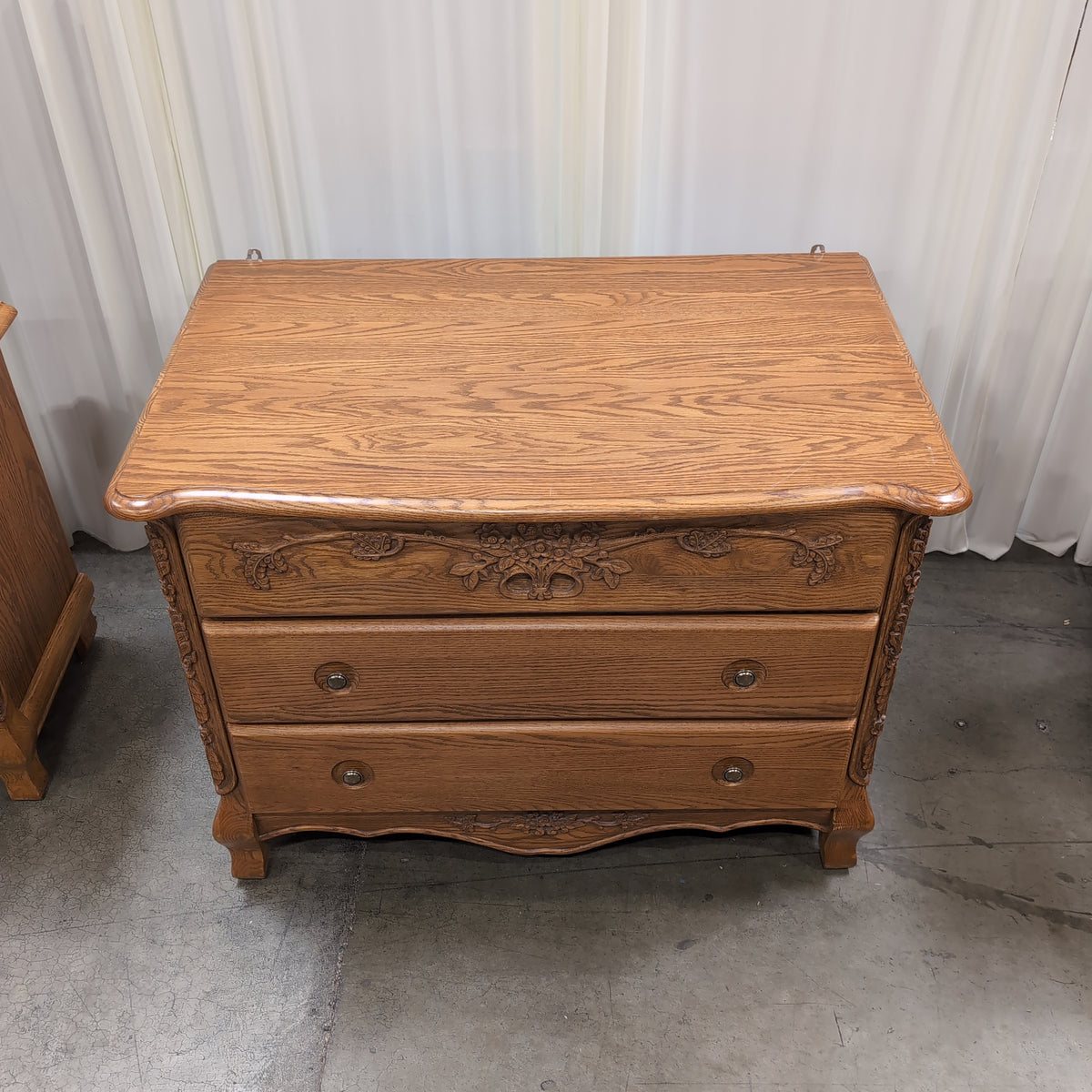 Ornate Carved Wood Three-Drawer Dresser with Floral Motifs