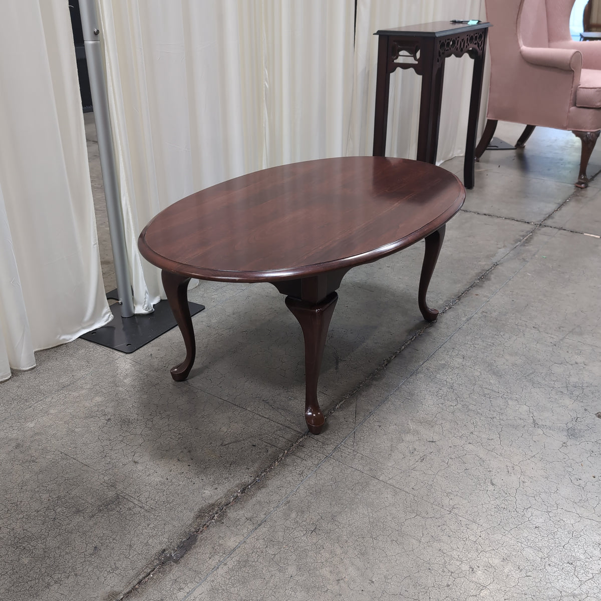 Dark Cherry Oval Wood Coffee Table with Cabriole Legs