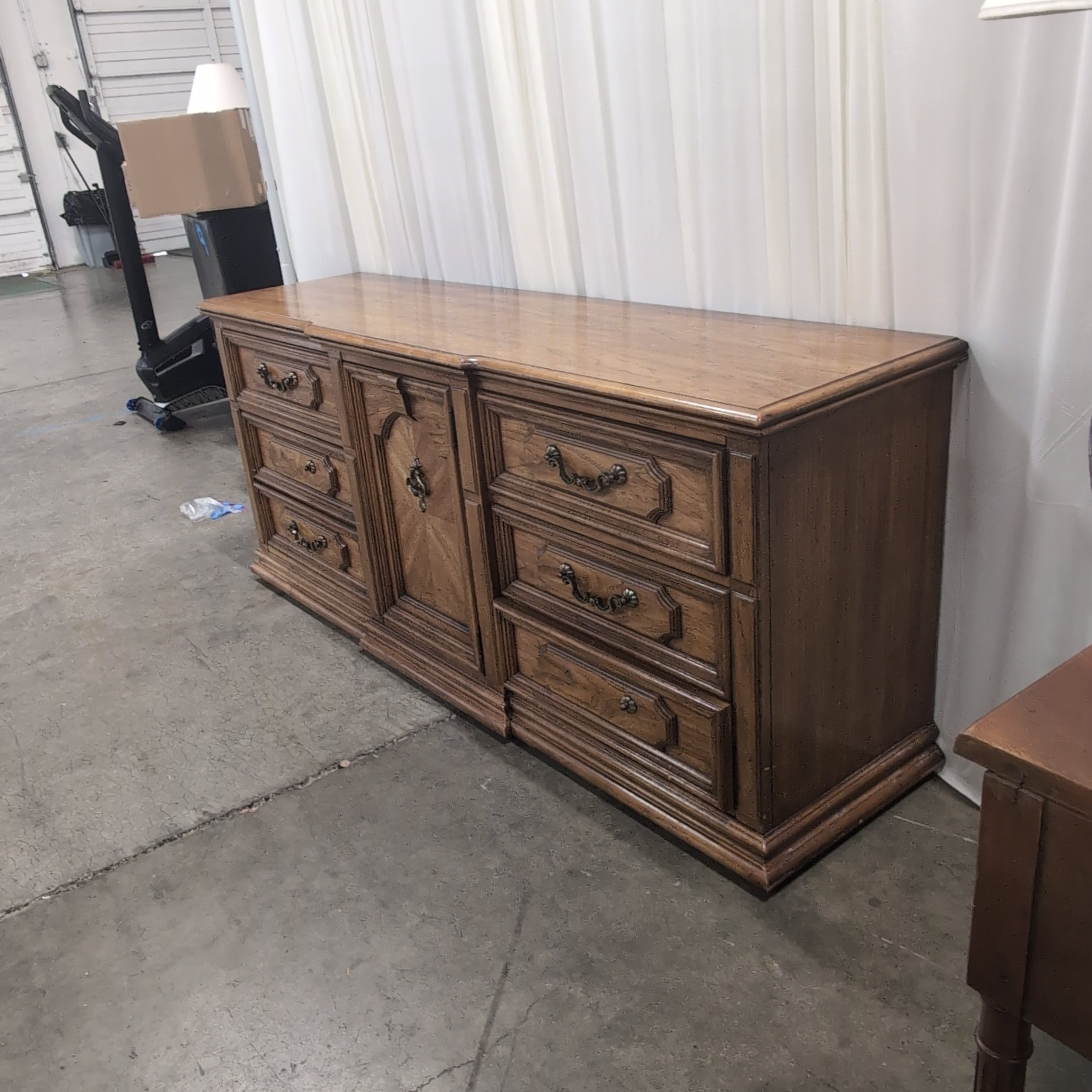 Traditional Brown Wood Dresser with Ornate Hardware