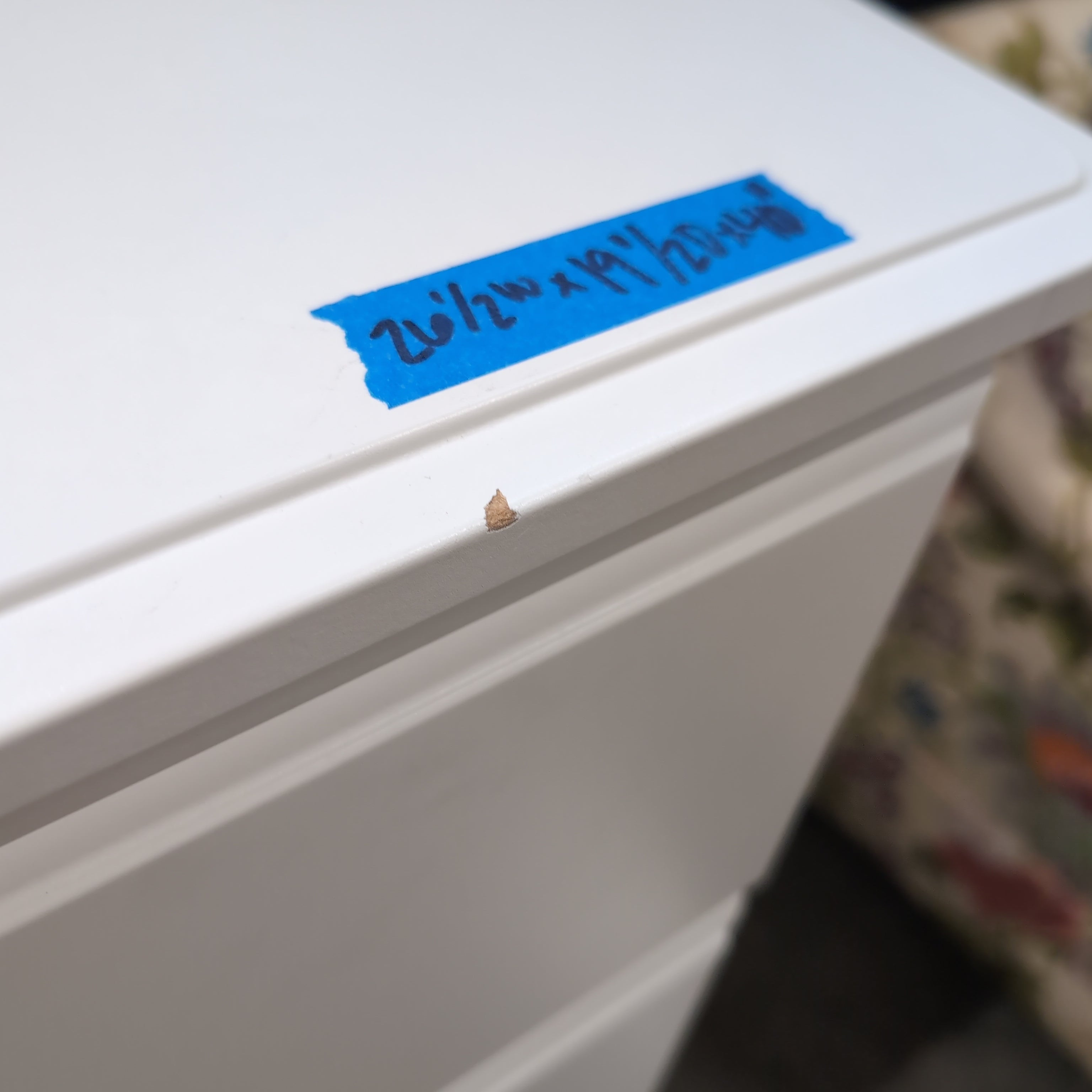 White Four-Drawer Dresser with Silver Pulls