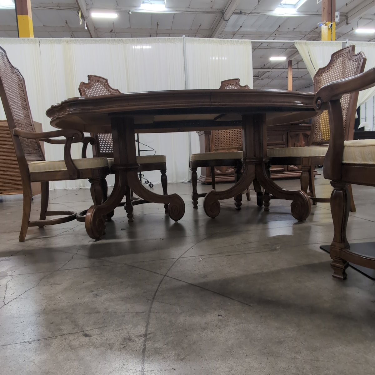 Ornate Brown Wood Dining Table With Six Cane Back Chairs