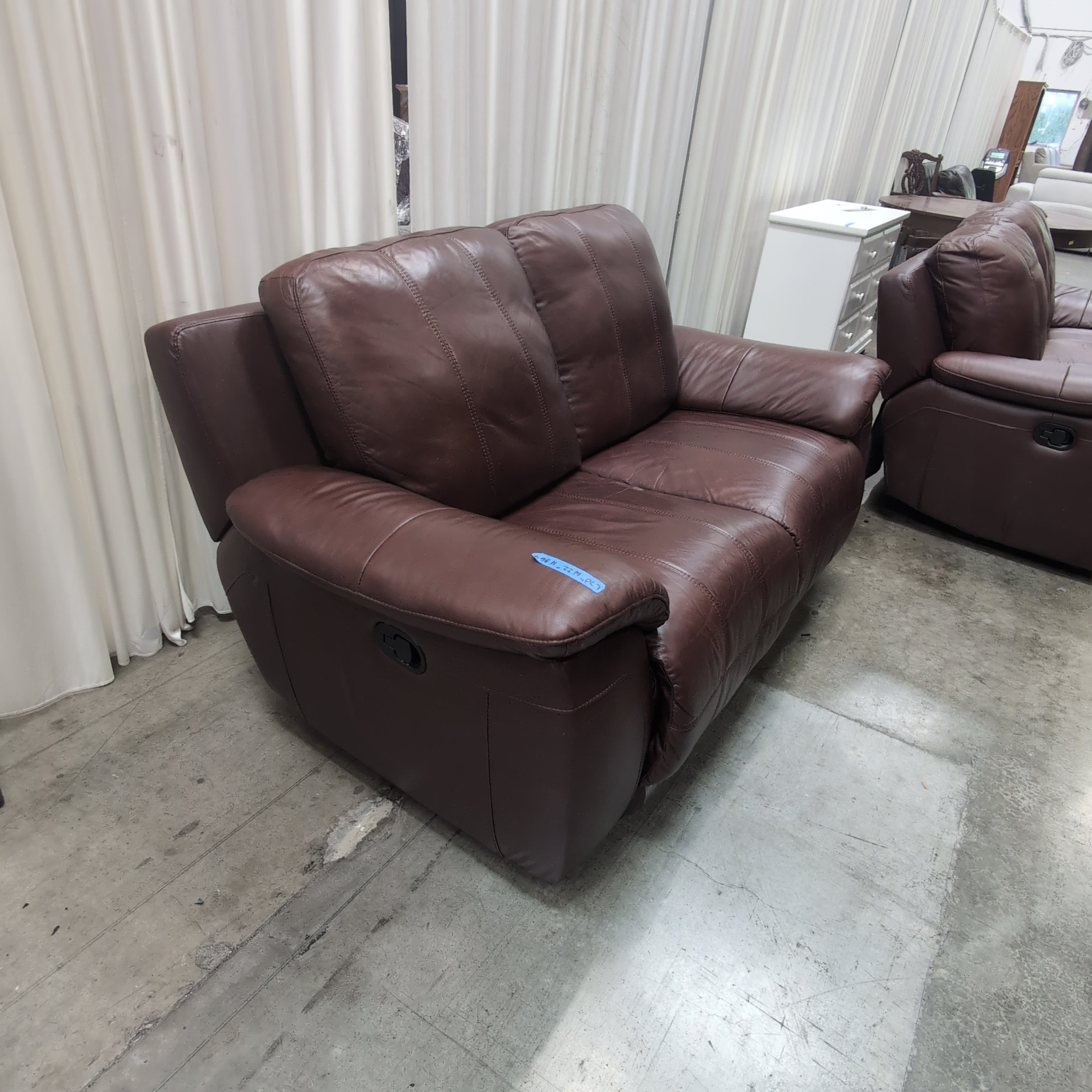 Deep Brown Leather Reclining Loveseat with Padded Arms