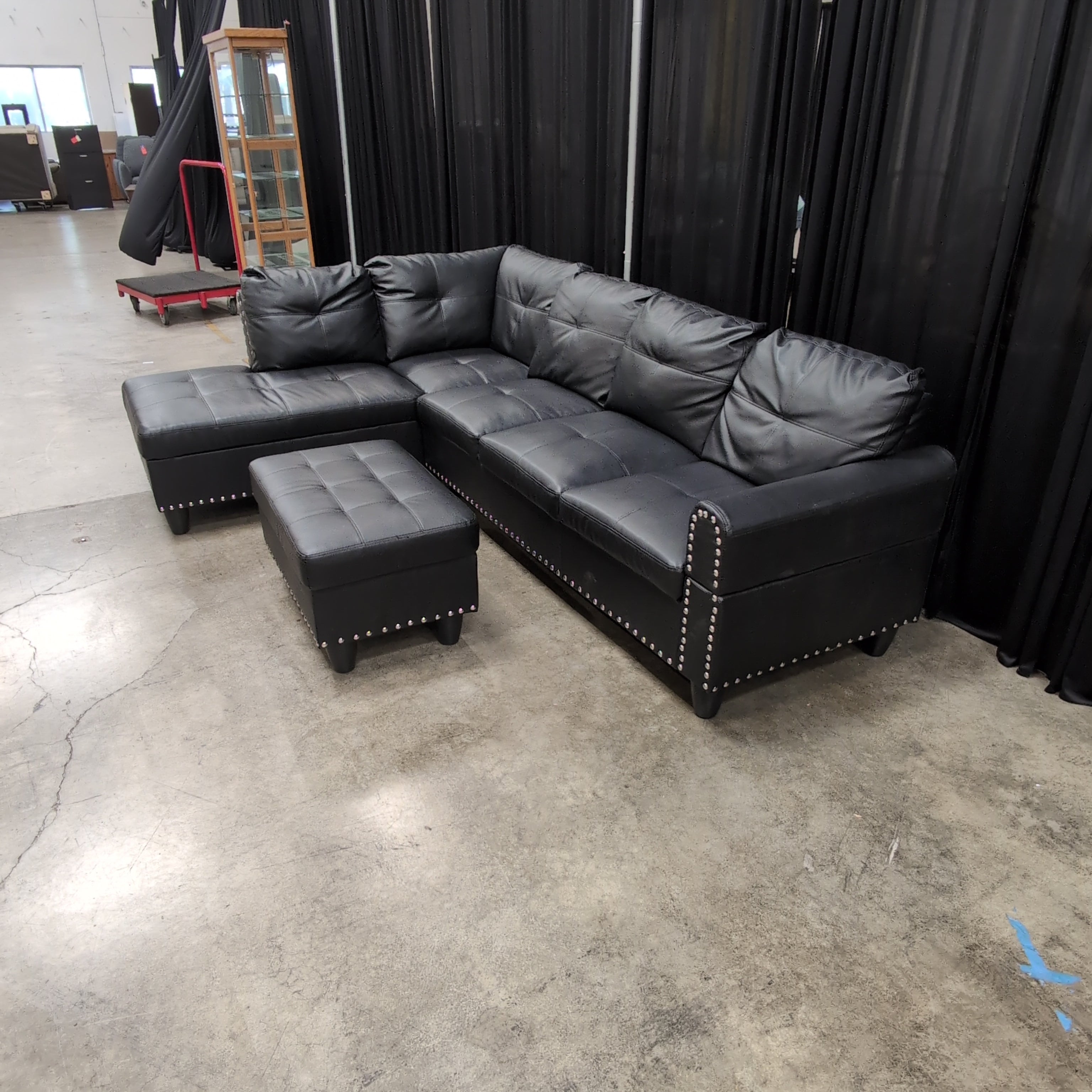 Black Faux Leather Sectional Couch with Ottoman