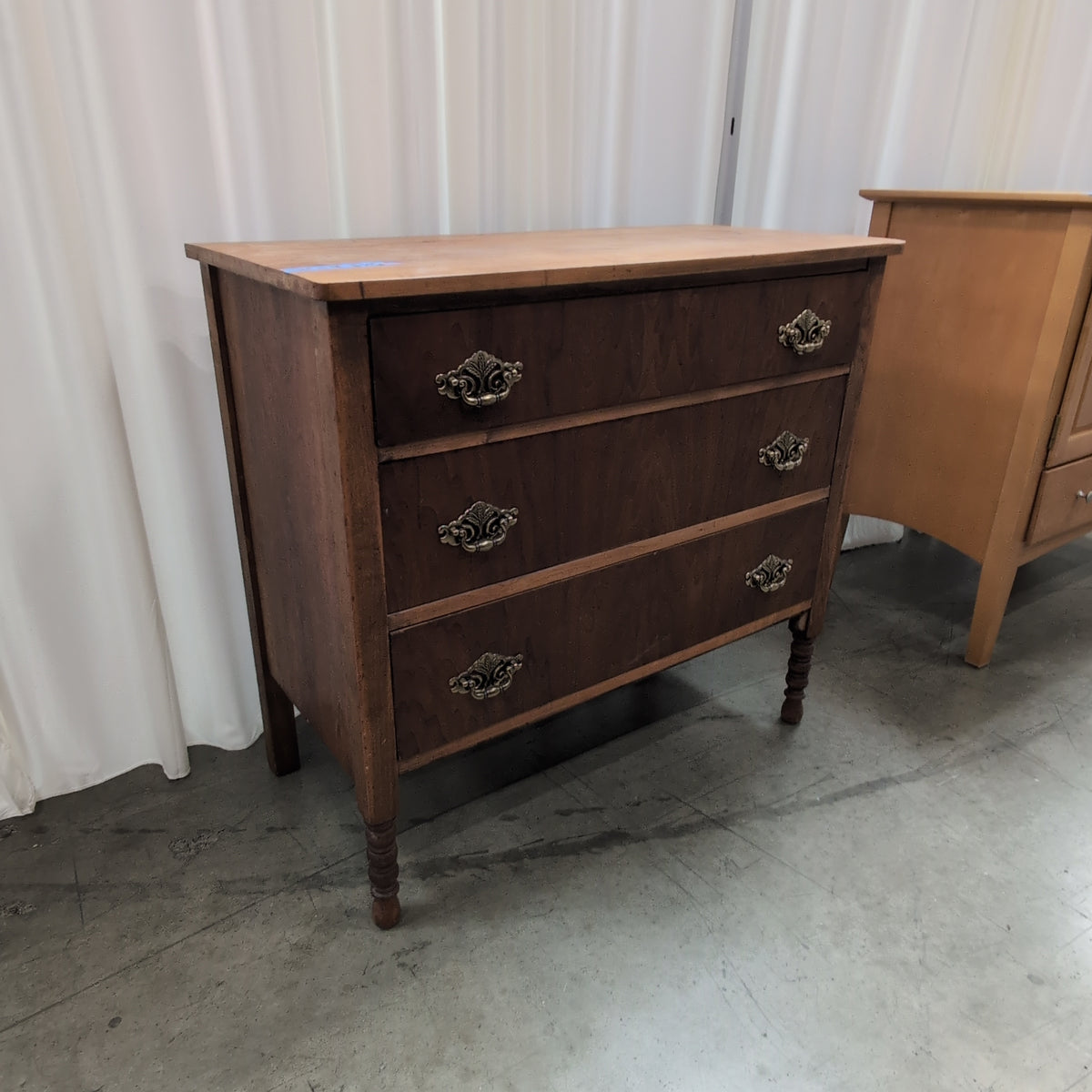 Antique Brown Wood Three-Drawer Dresser with Ornate Hardware
