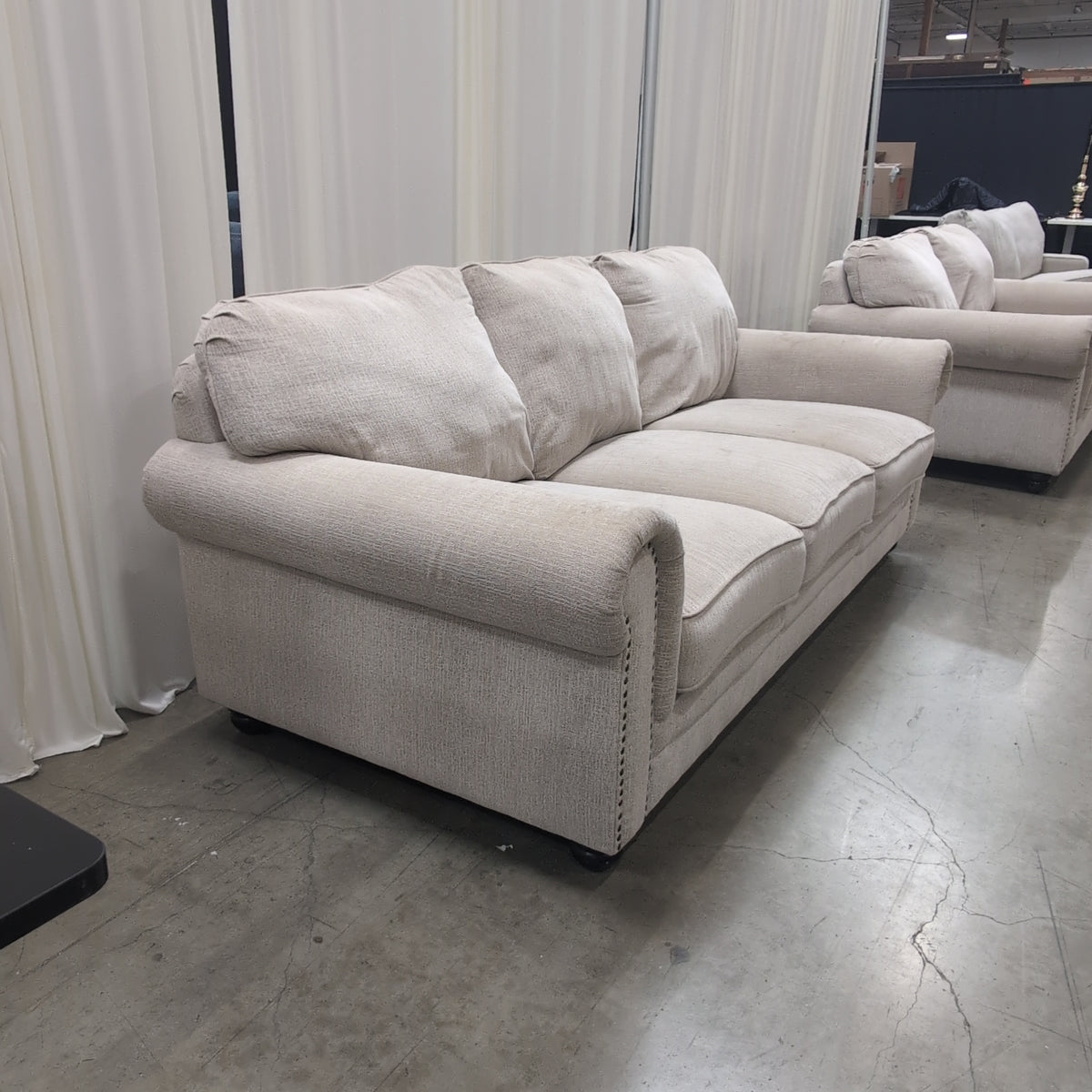 Light Beige Rolled Arm Couch with Nailhead Trim