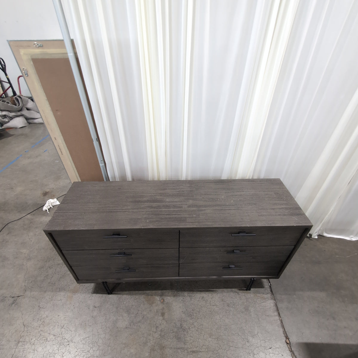 Minimalist Dark Wood Six-Drawer Dresser with Black Legs