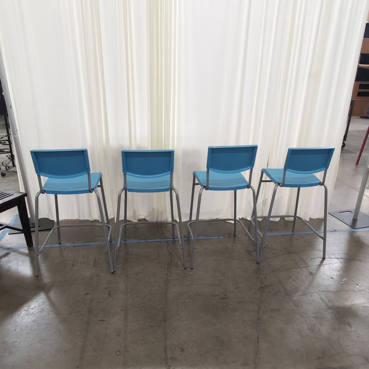 Set of Four Stackable Blue Plastic Chairs