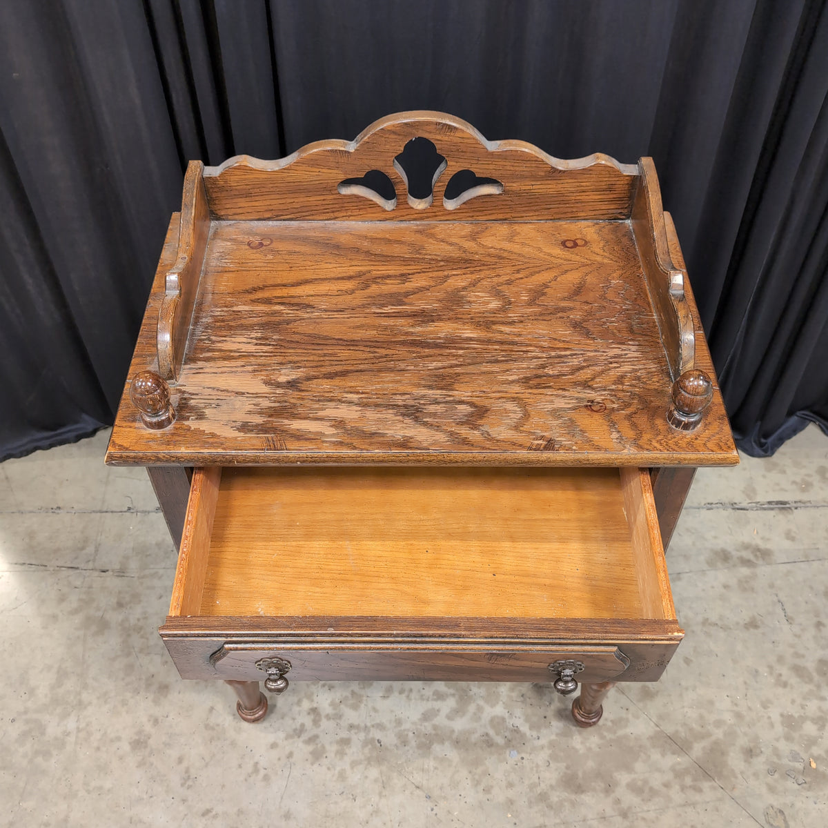 Dark Stained Wood Nightstand with Ornate Hardware
