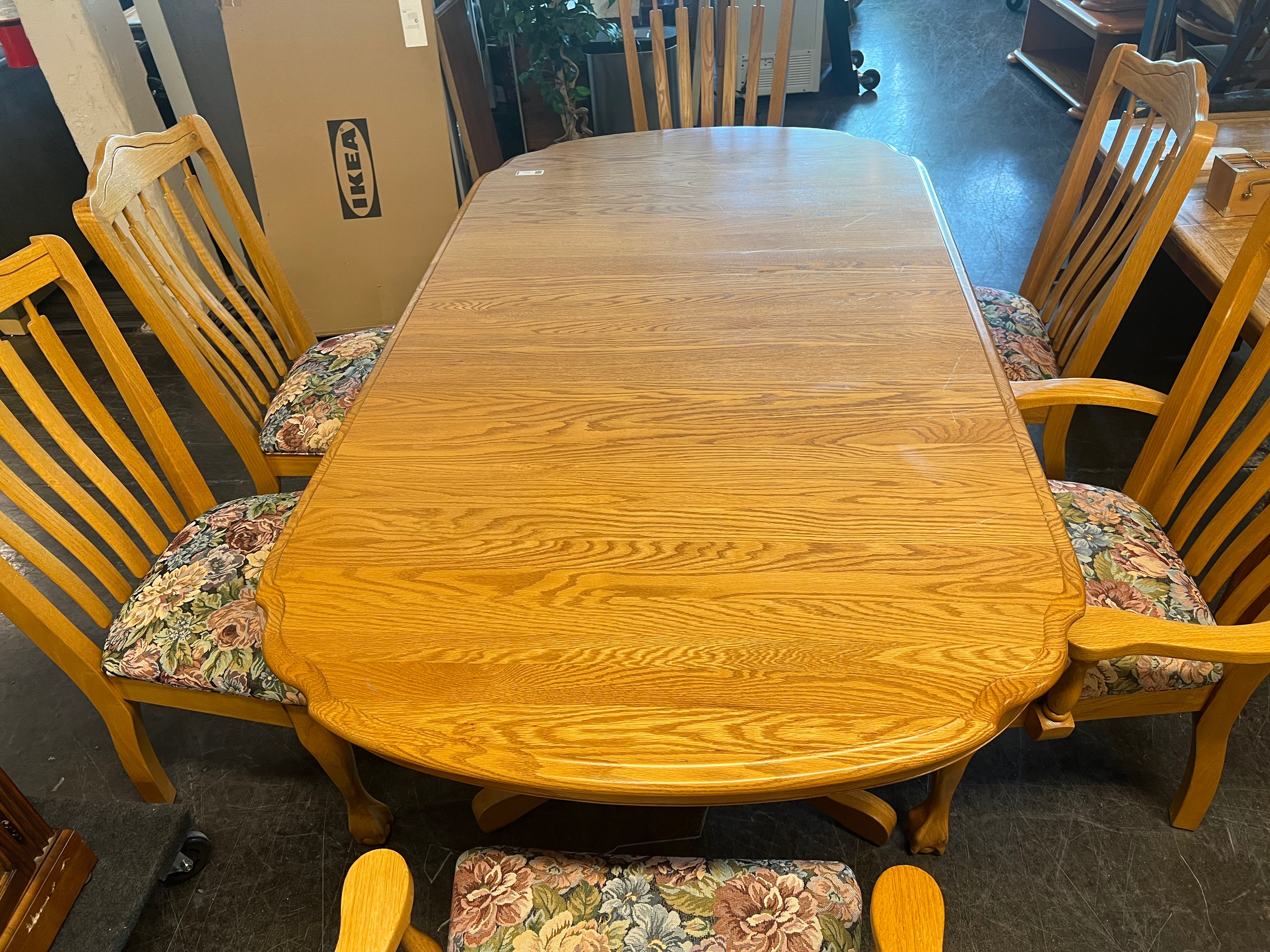Oval Oak Dinning Table with Six Chairs with Floral Accent