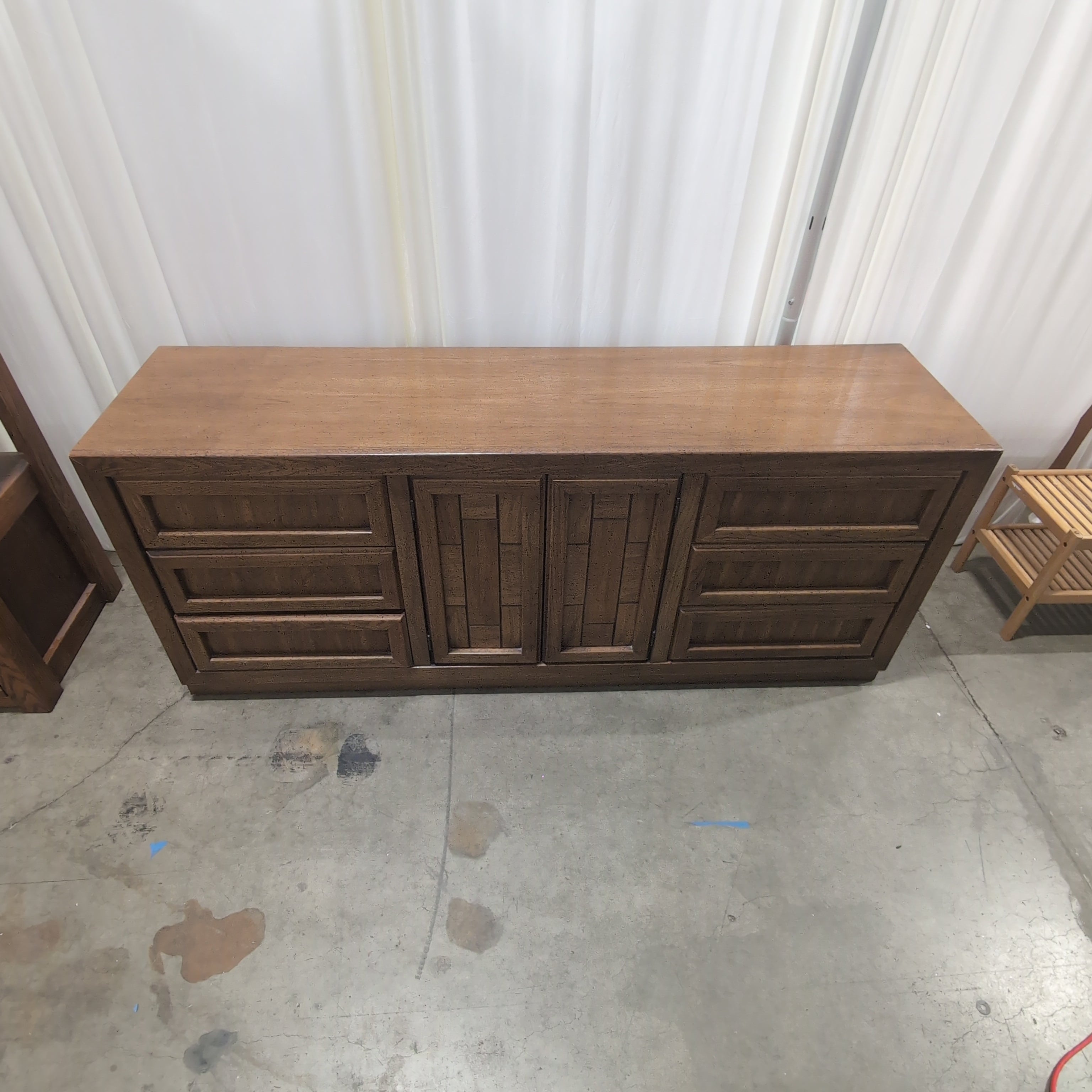Long Brown Wood Dresser with Geometric Paneling