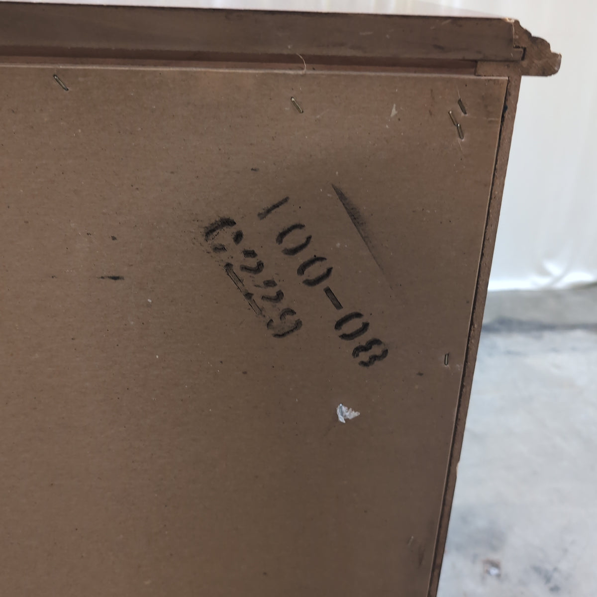 Traditional Dark Wood Three-Drawer Nightstand with Ornate Hardware
