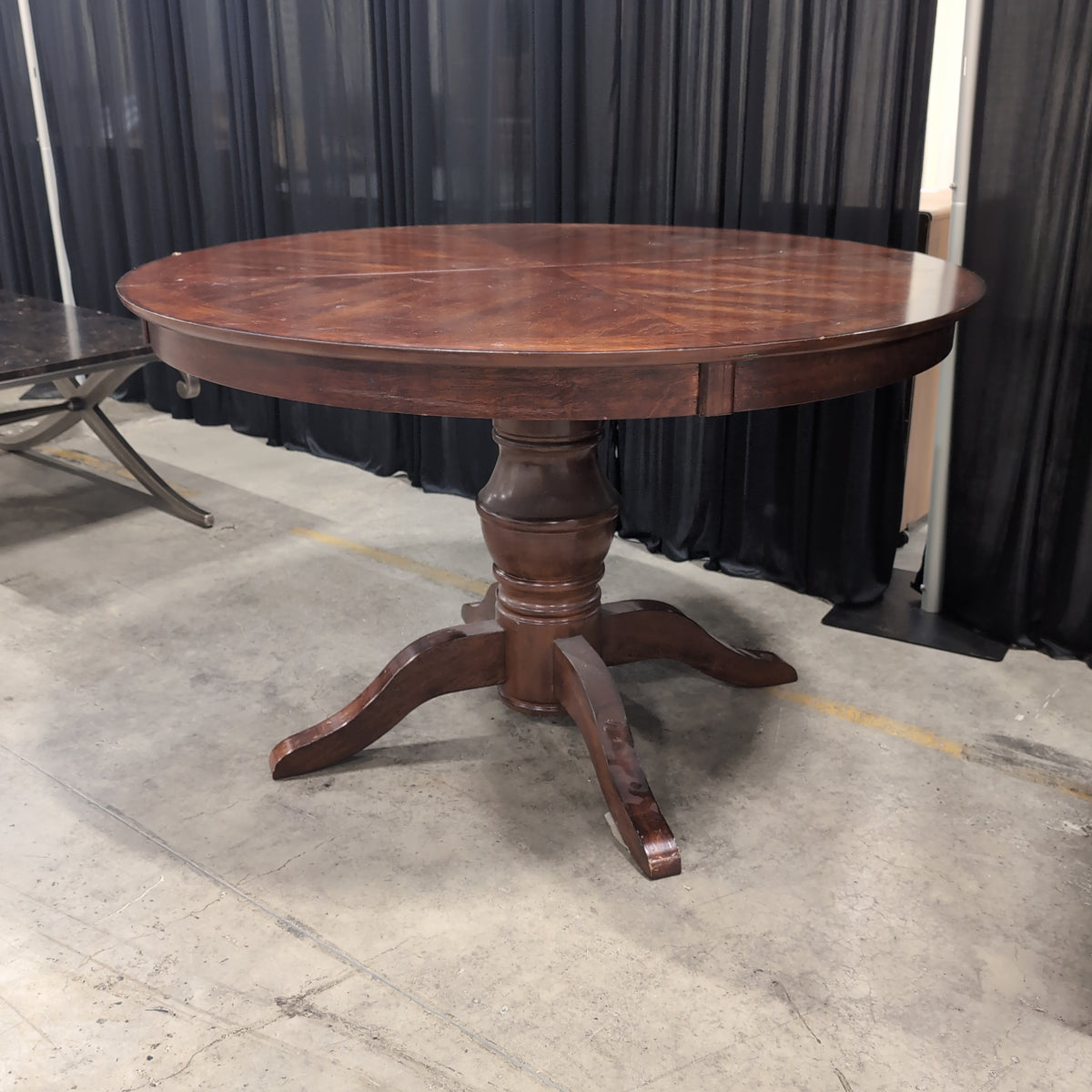 Round Dark Wood Dining Table with Pedestal Base