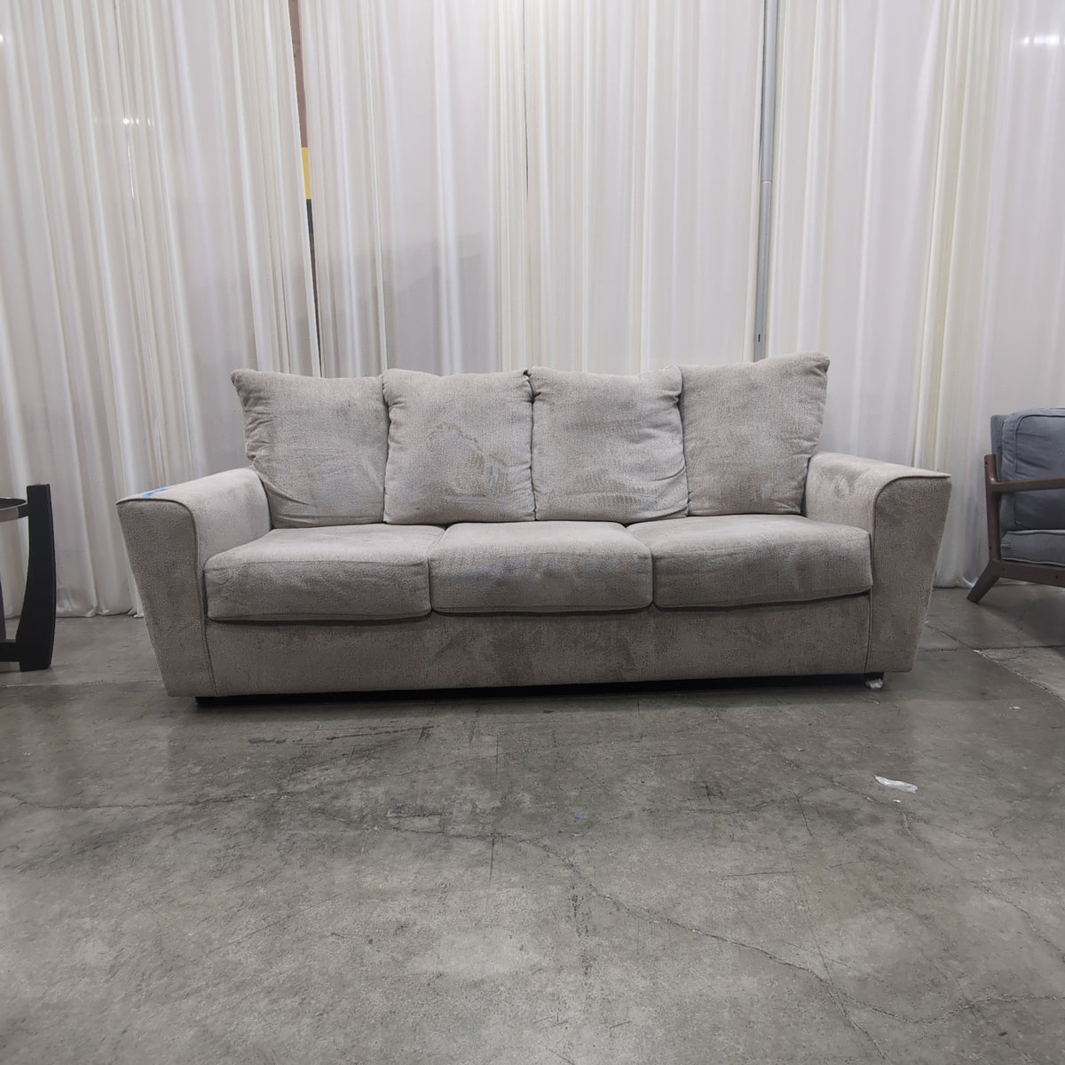 Light Beige Upholstered Three-Seat Couch