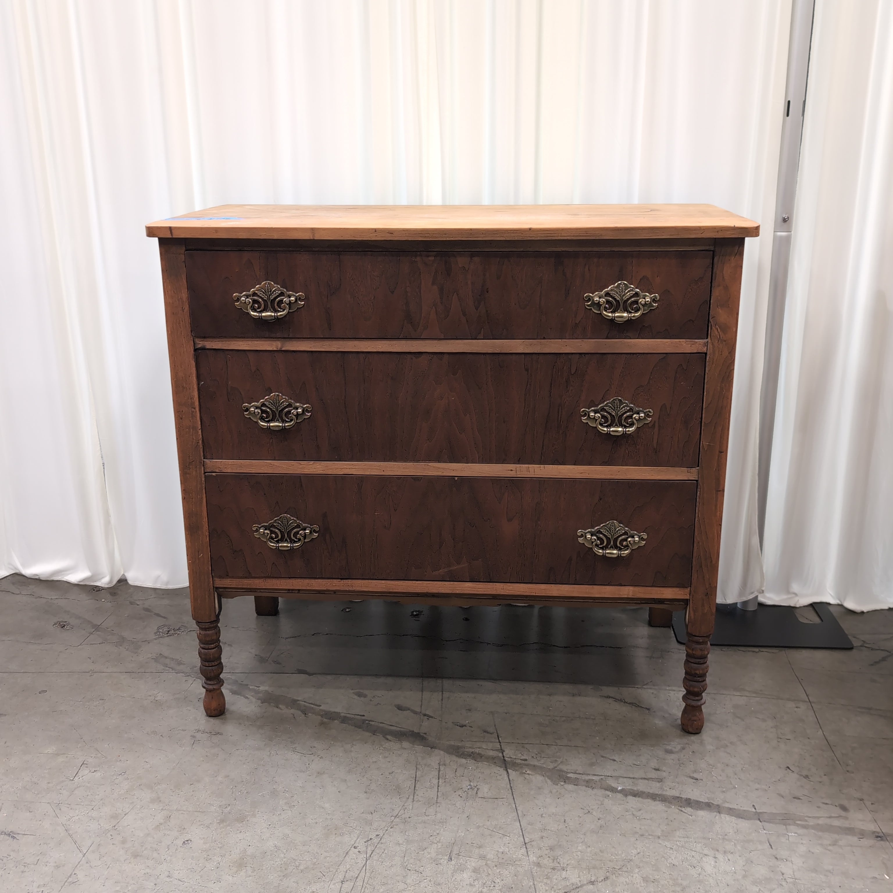 Antique Brown Wood Three-Drawer Dresser with Ornate Hardware