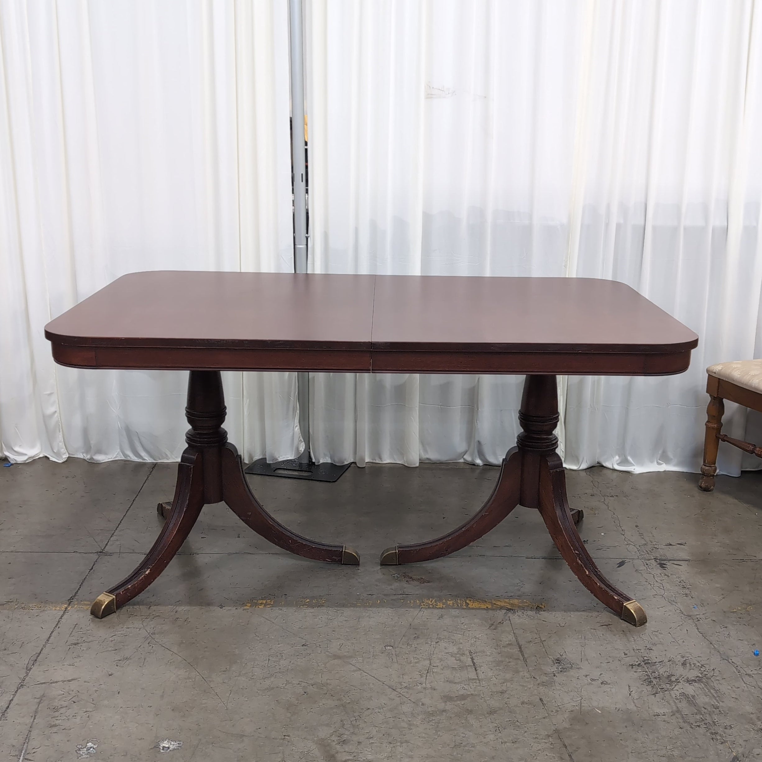 Reddish Brown Hardwood Dining Table with Rounded Corners