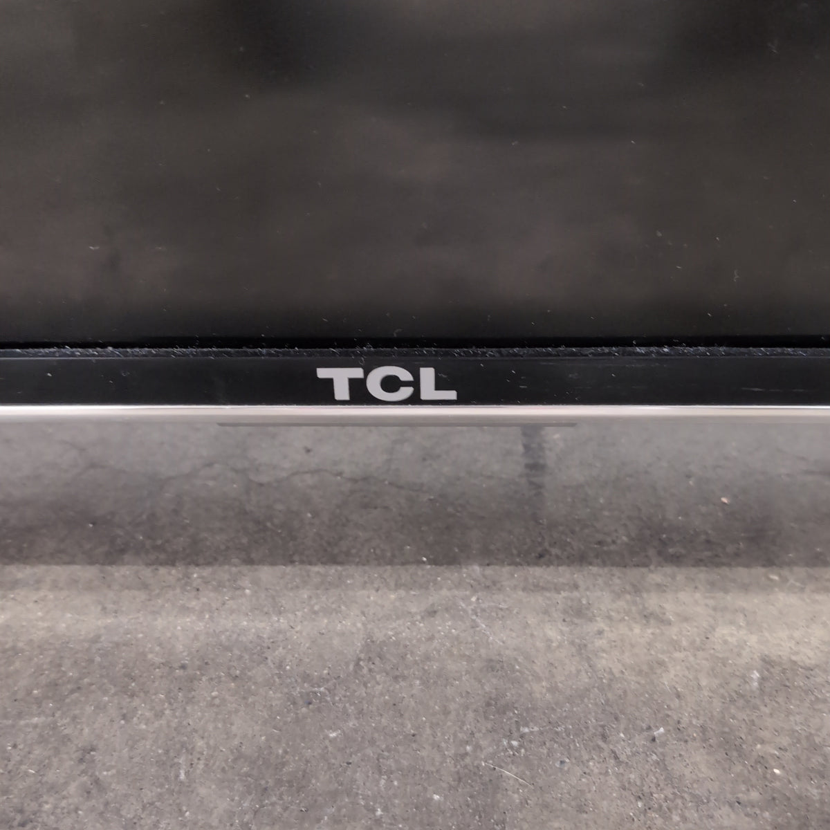 TCL-Slim Black Flat Screen TV with White Back