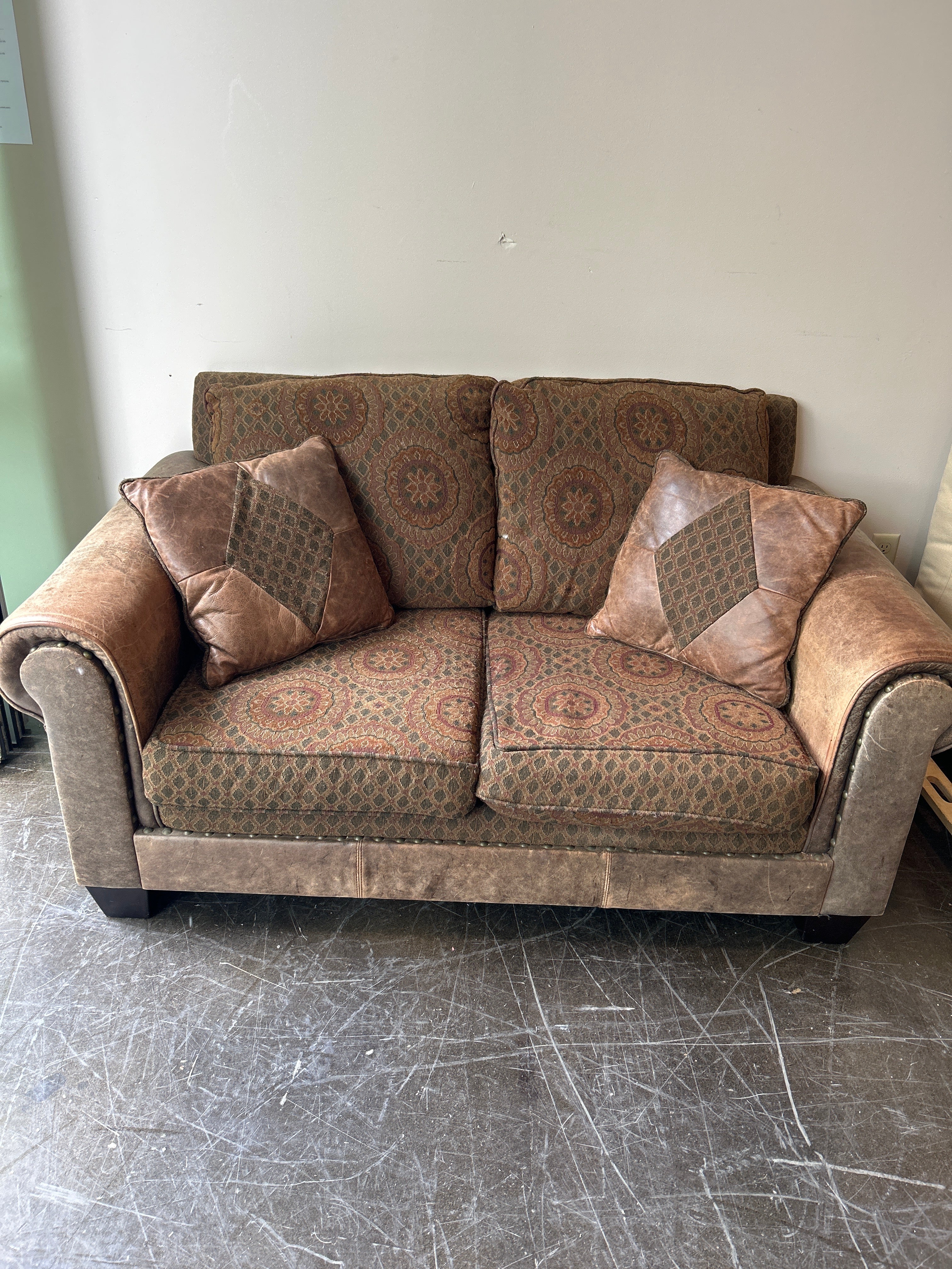 Brown and Rust Pattern Loveseat with Leather Accent