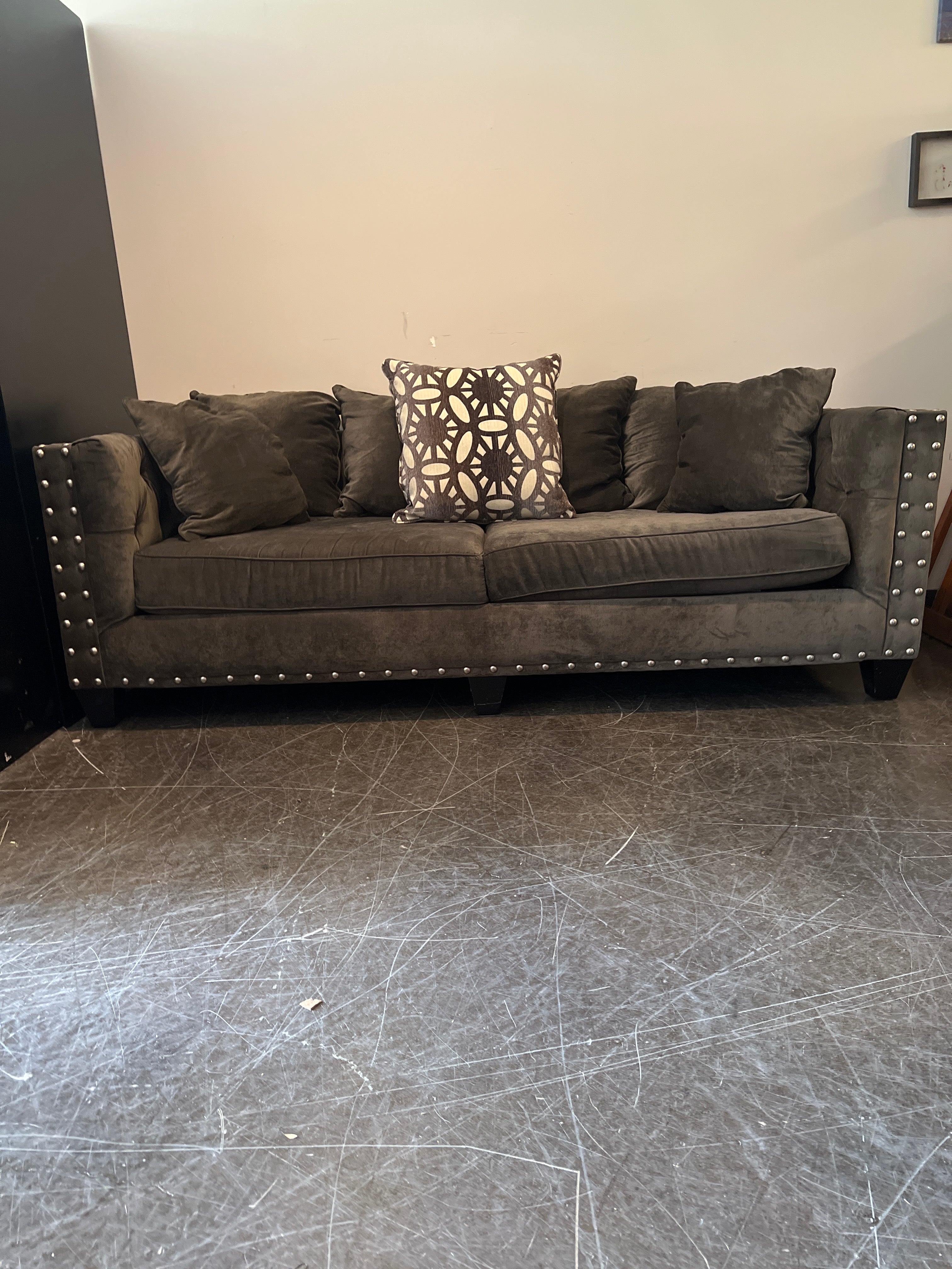 Dark Brown Tufted Sofa with Metal Accents