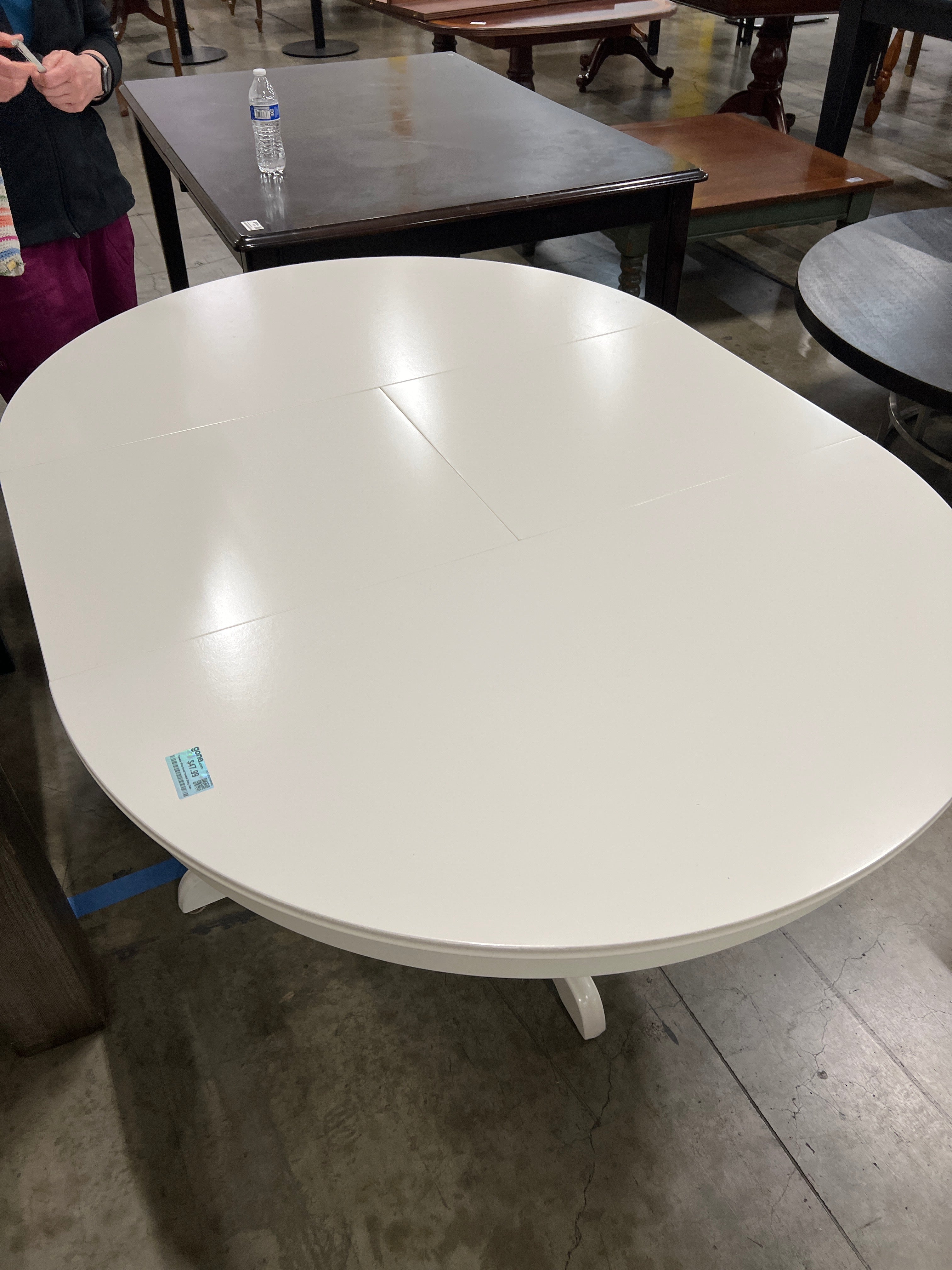 Versatile White Round Pedestal Dining Table with in-built leaf
