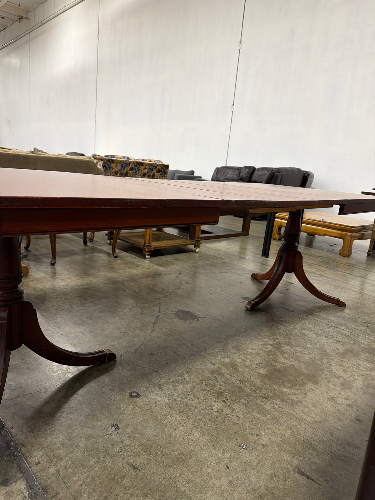 Reddish Brown Hardwood Dining Table with Rounded Corners