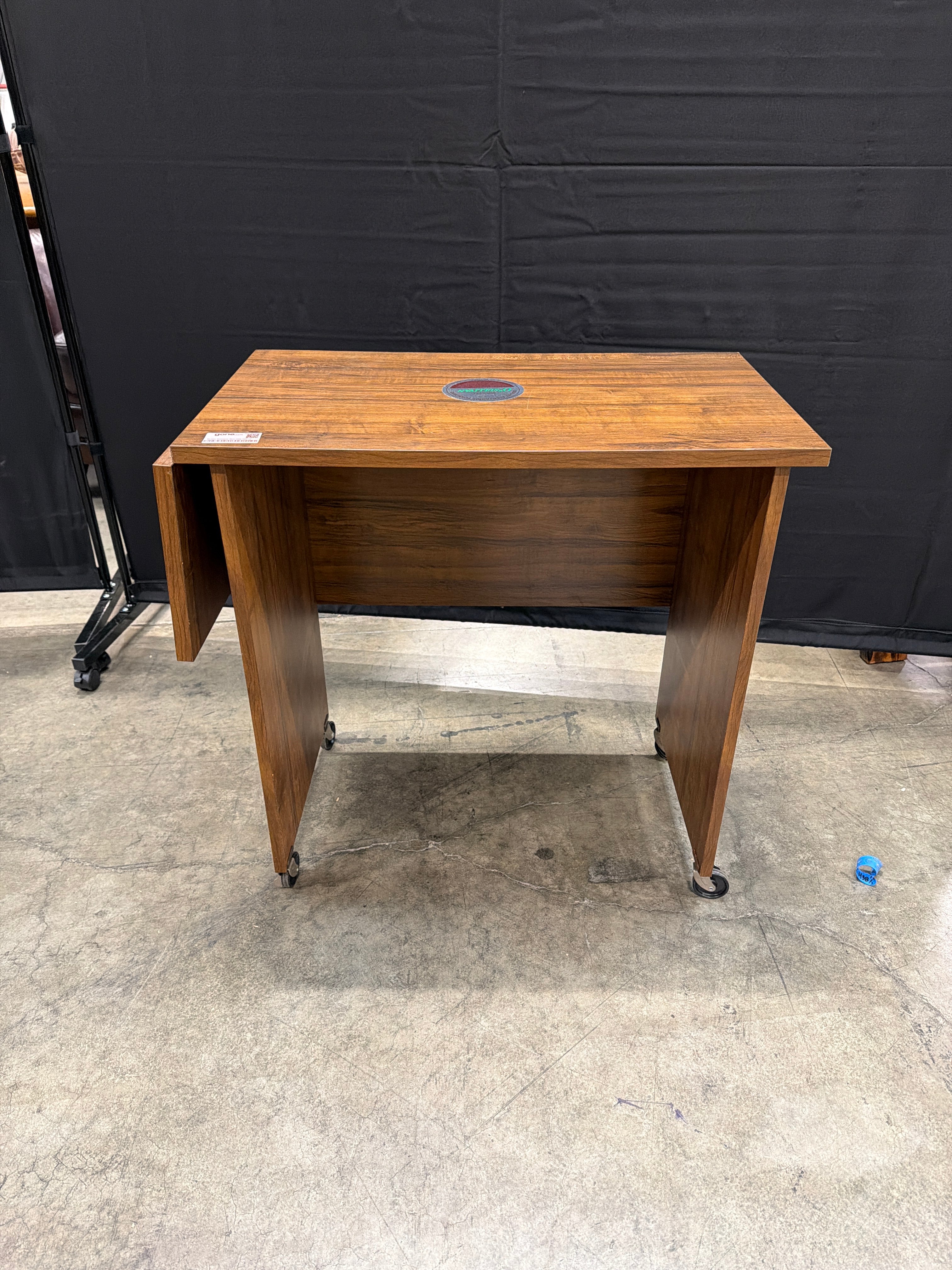 O’Sullivan Rectangular Wood Utility Table with Folding Leaf and Rolling Casters