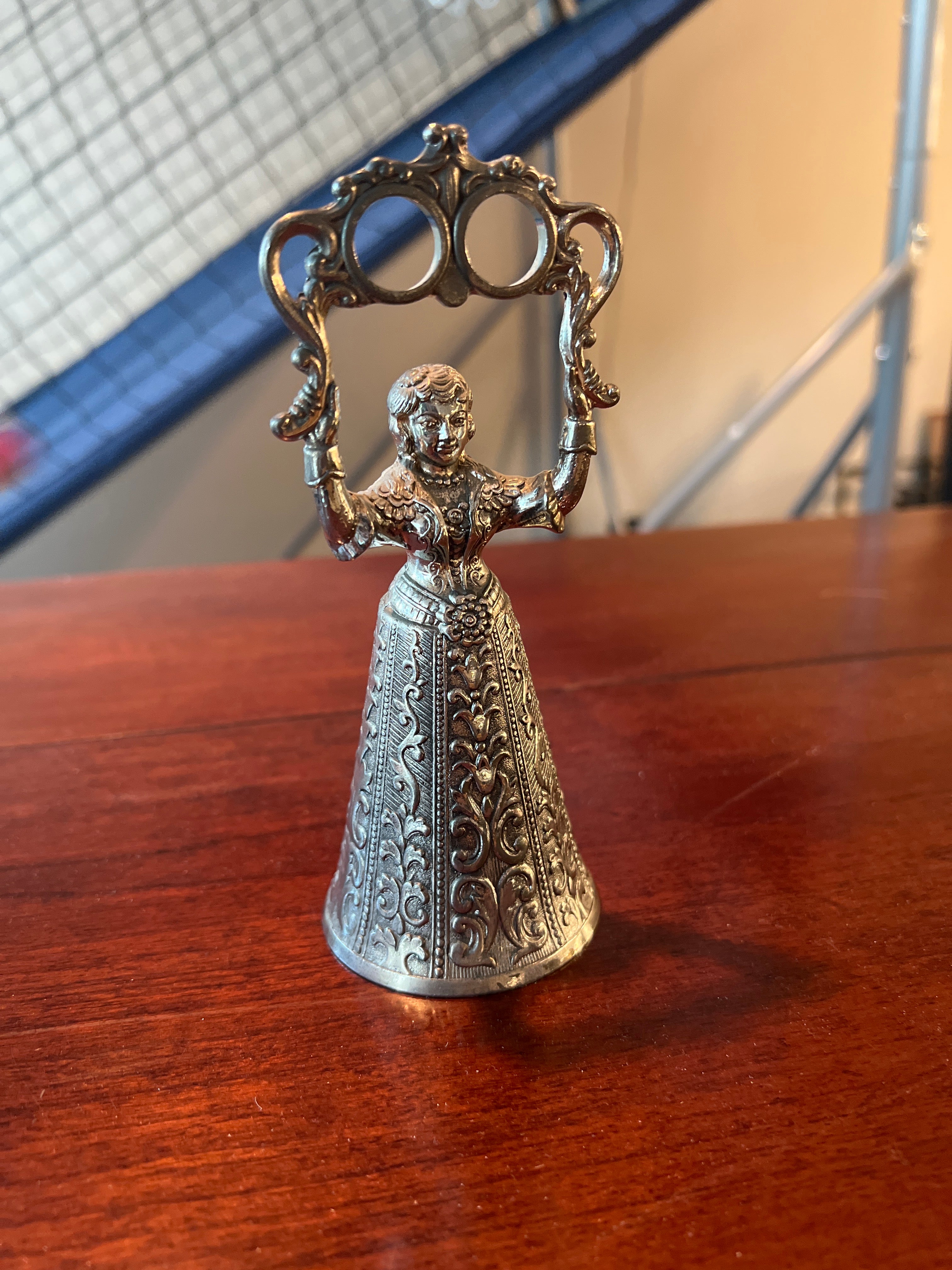 Ornate Metallic Decorative Bell with Sculpted Base